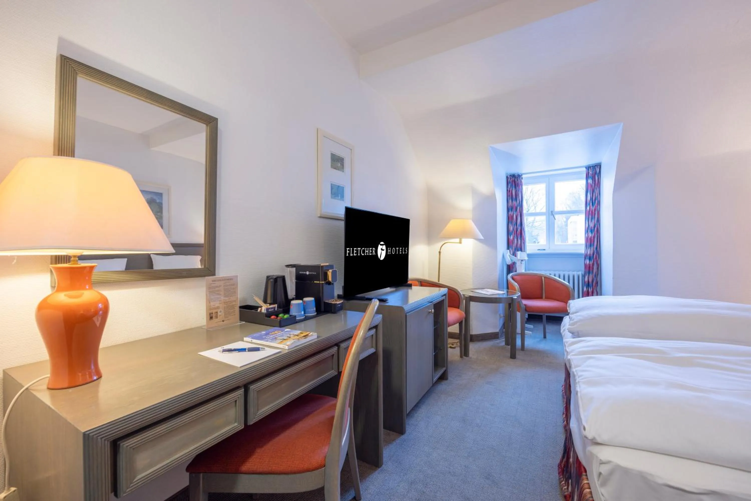 Communal lounge/ TV room, Bed in Fletcher Waldhotel Nordrhein-Westfalen