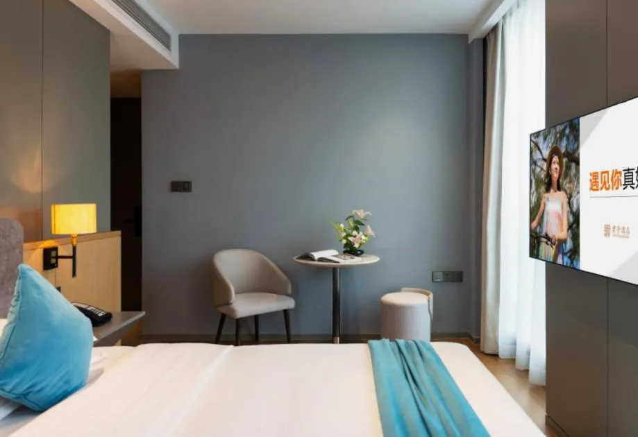 Bed in SSAW Boutique Hotel Wenzhou Dexin