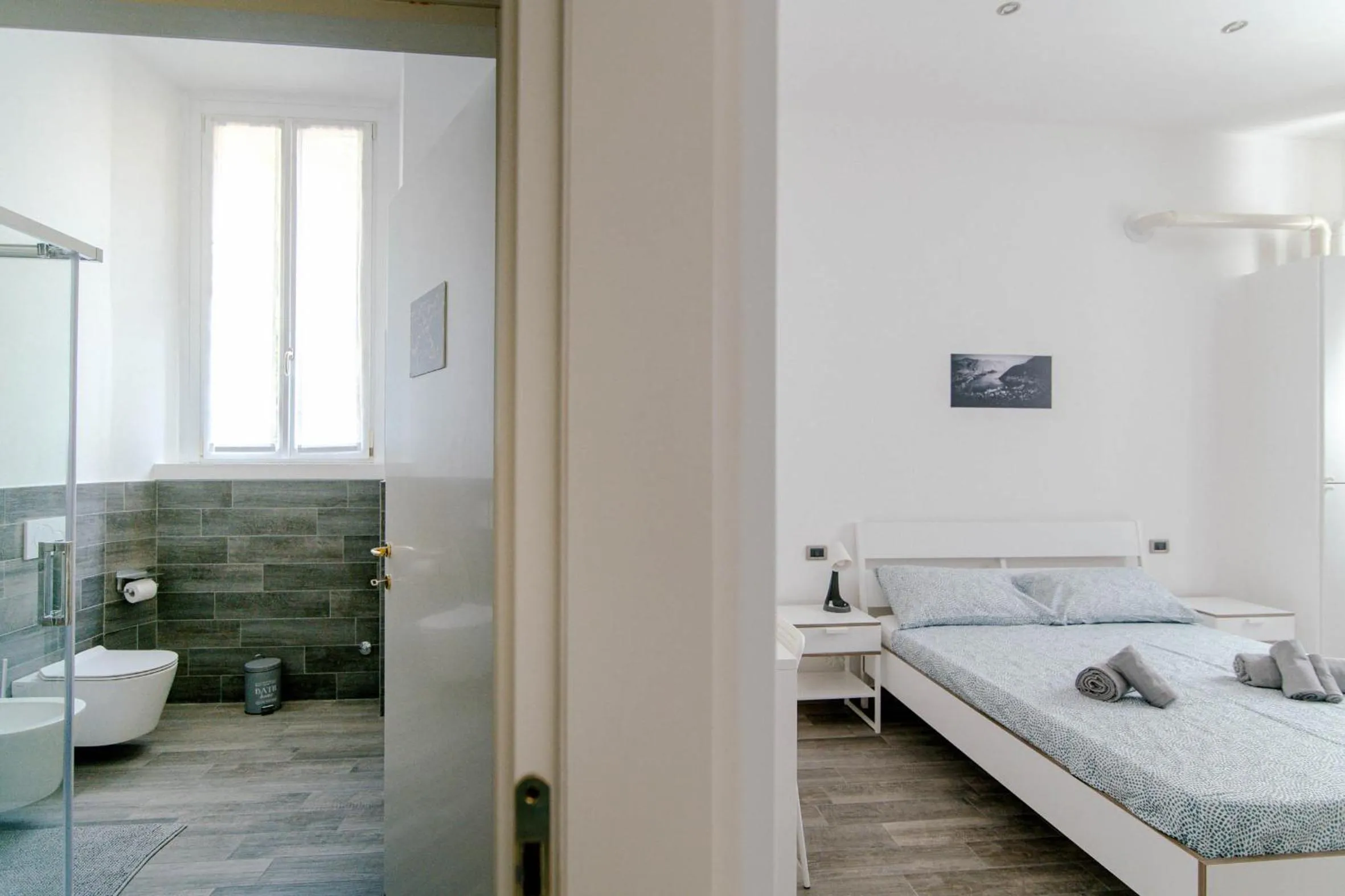 Bathroom, Bed in Downtown Rooms