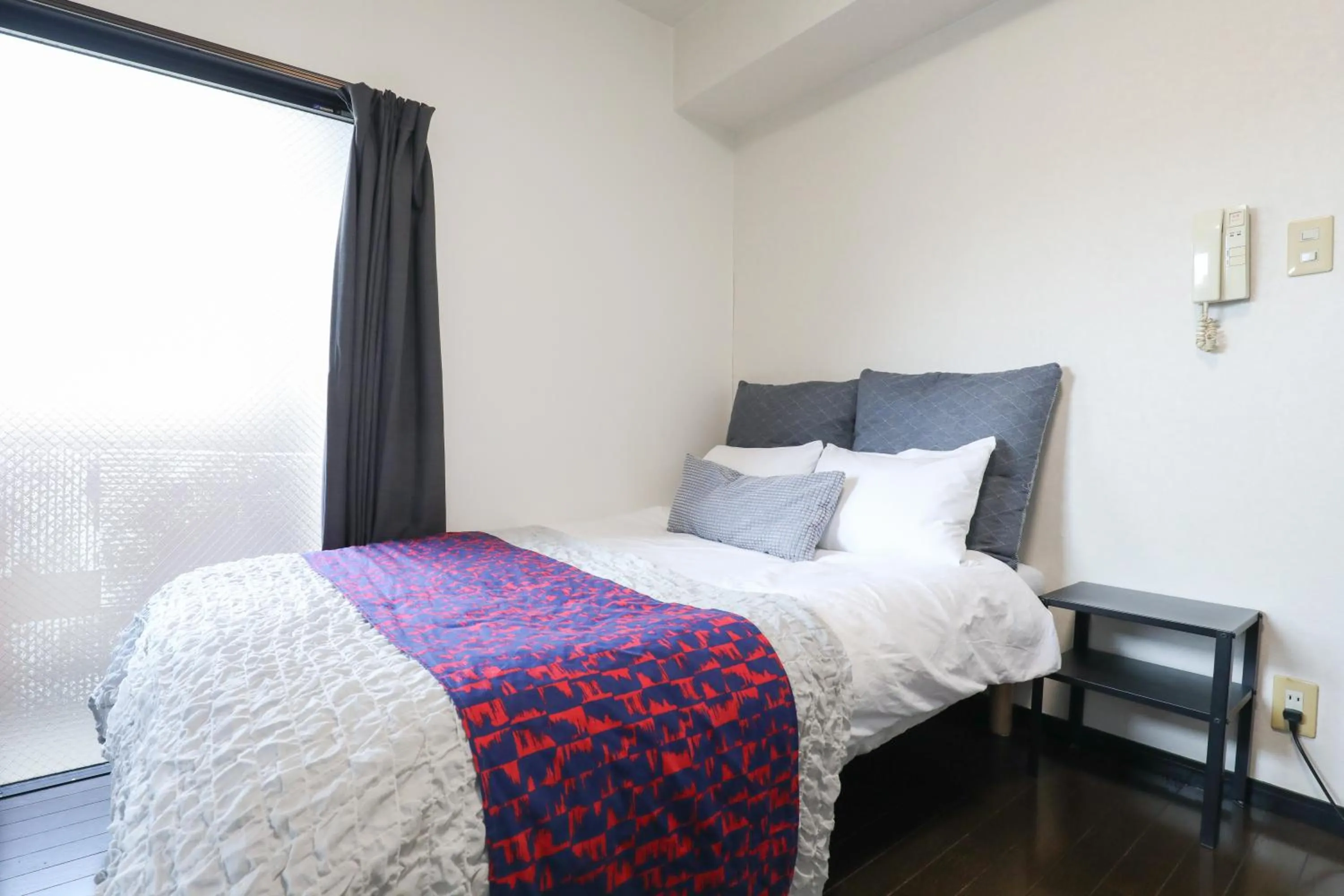 Bed in SUMIYOSHI APARTMENT Hotel 住吉アパートメントホテル