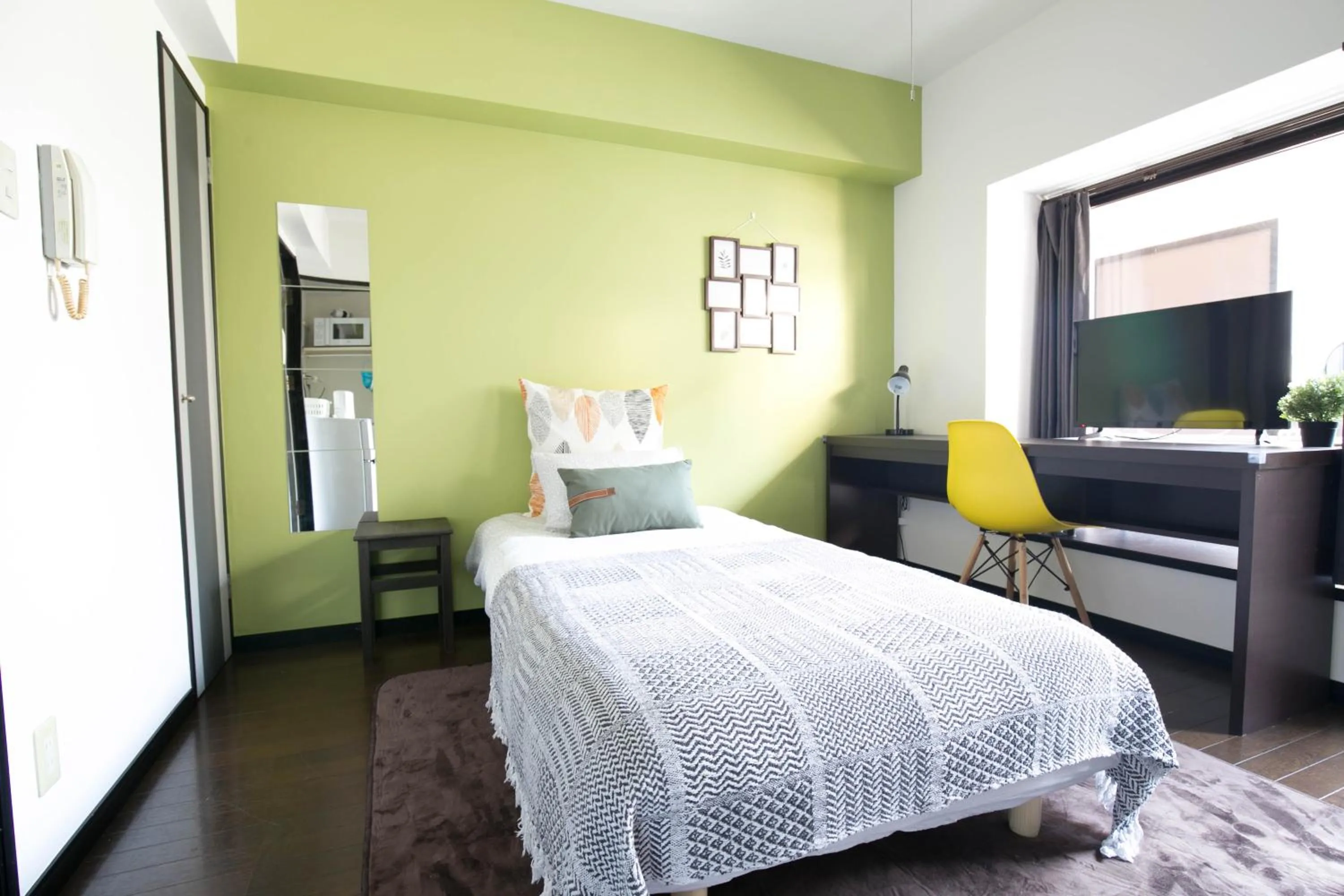 Bed in SUMIYOSHI APARTMENT Hotel 住吉アパートメントホテル