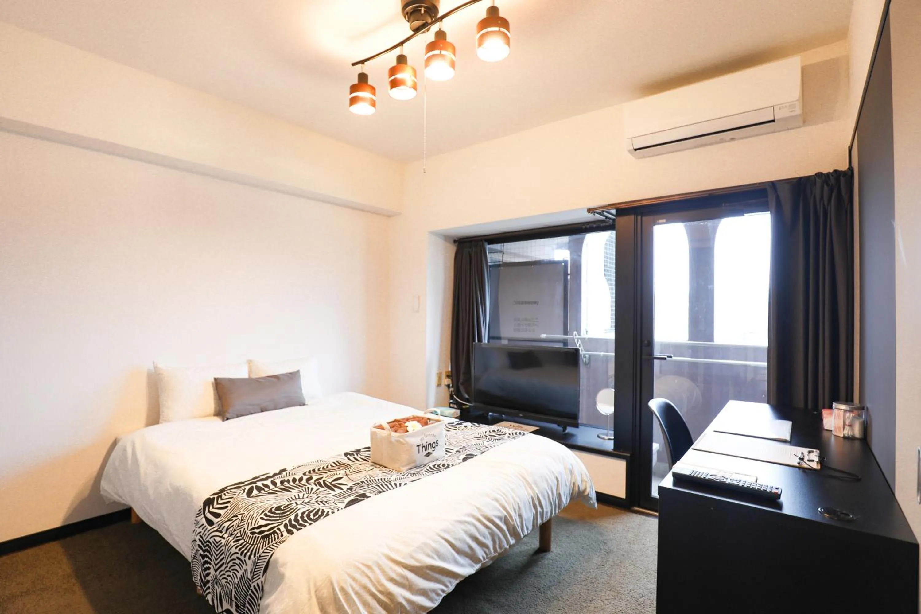 Bed in SUMIYOSHI APARTMENT Hotel 住吉アパートメントホテル