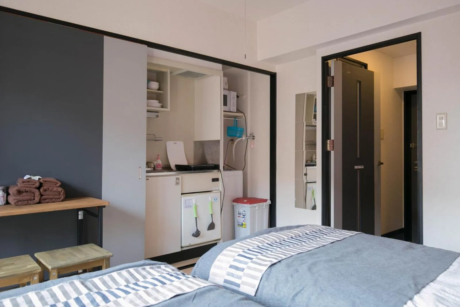 Bed in SUMIYOSHI APARTMENT Hotel 住吉アパートメントホテル