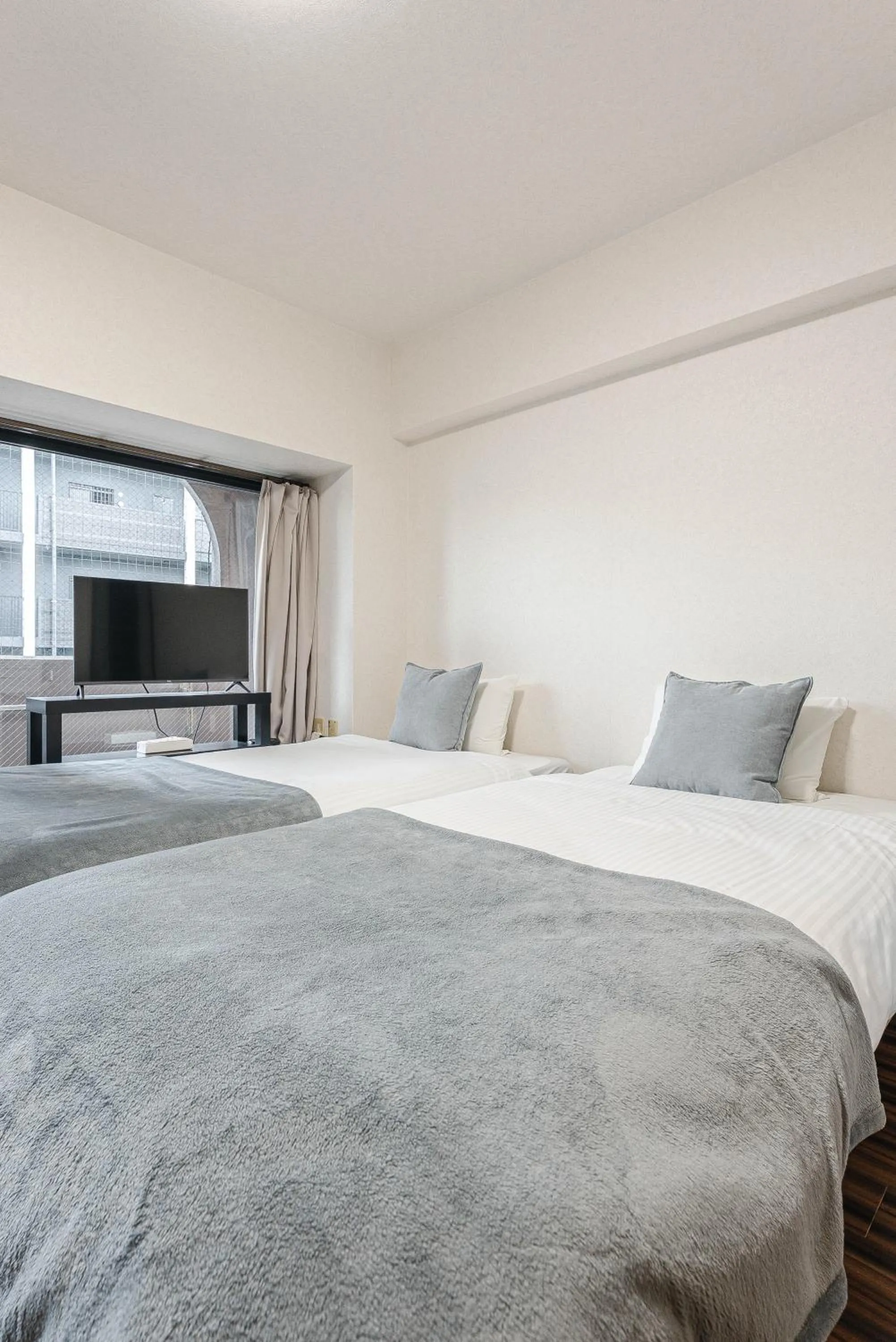 Bed in SUMIYOSHI APARTMENT Hotel 住吉アパートメントホテル