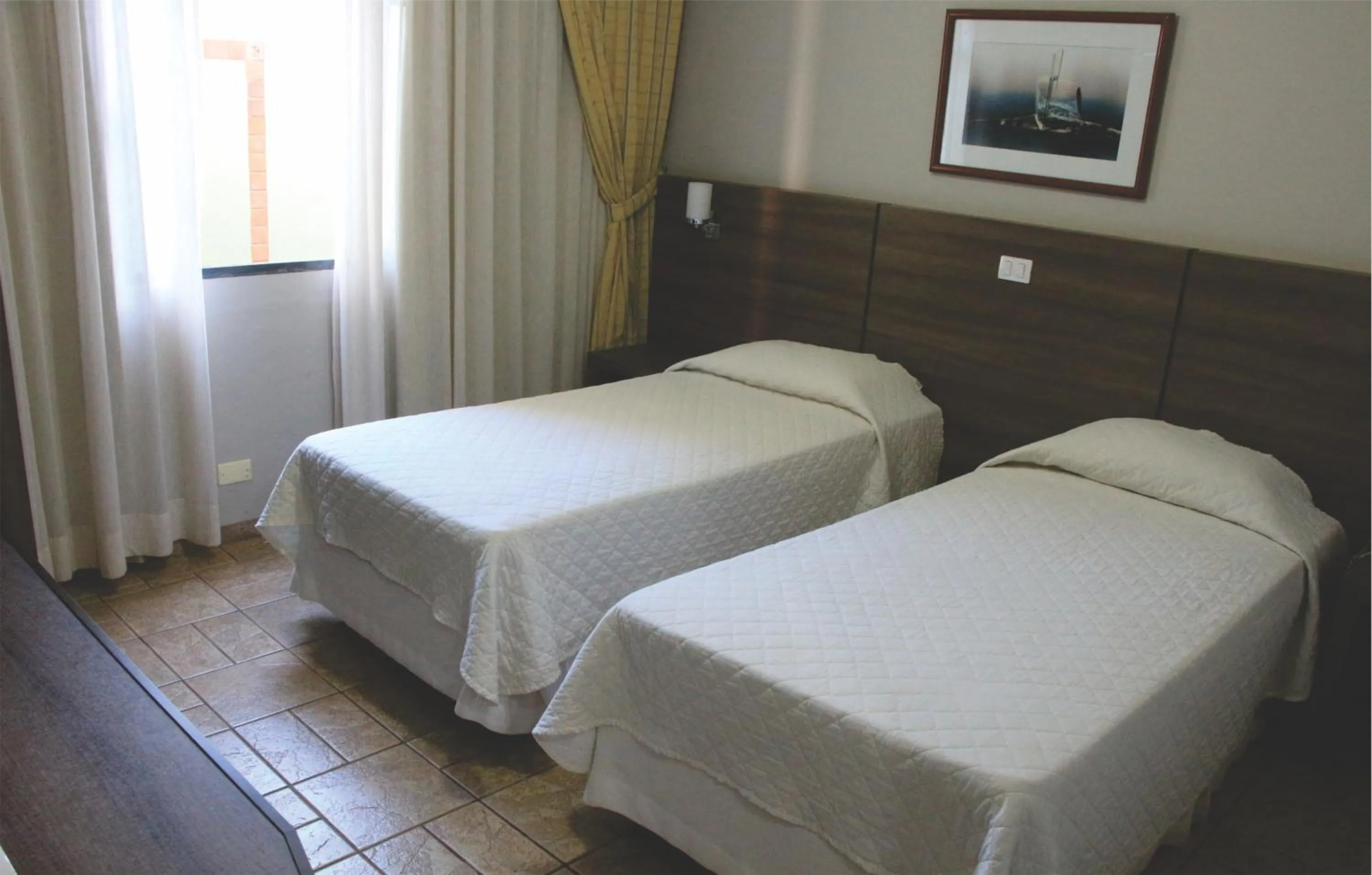 Bed in PARANÁ PALACE HOTEL