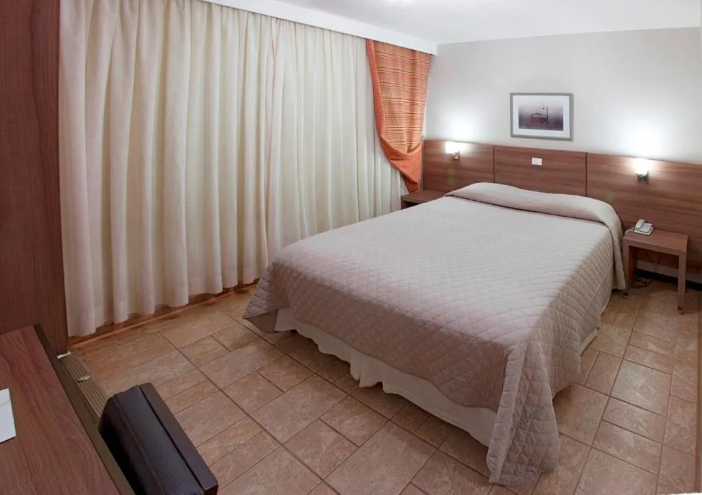 Bed in PARANÁ PALACE HOTEL