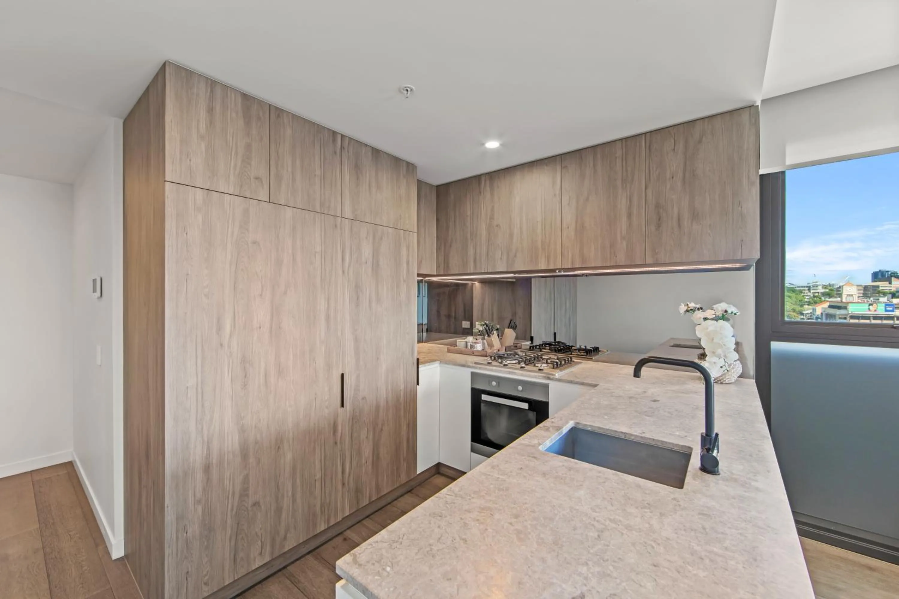 kitchen in Fortitude Valley Apartments by CLLIX