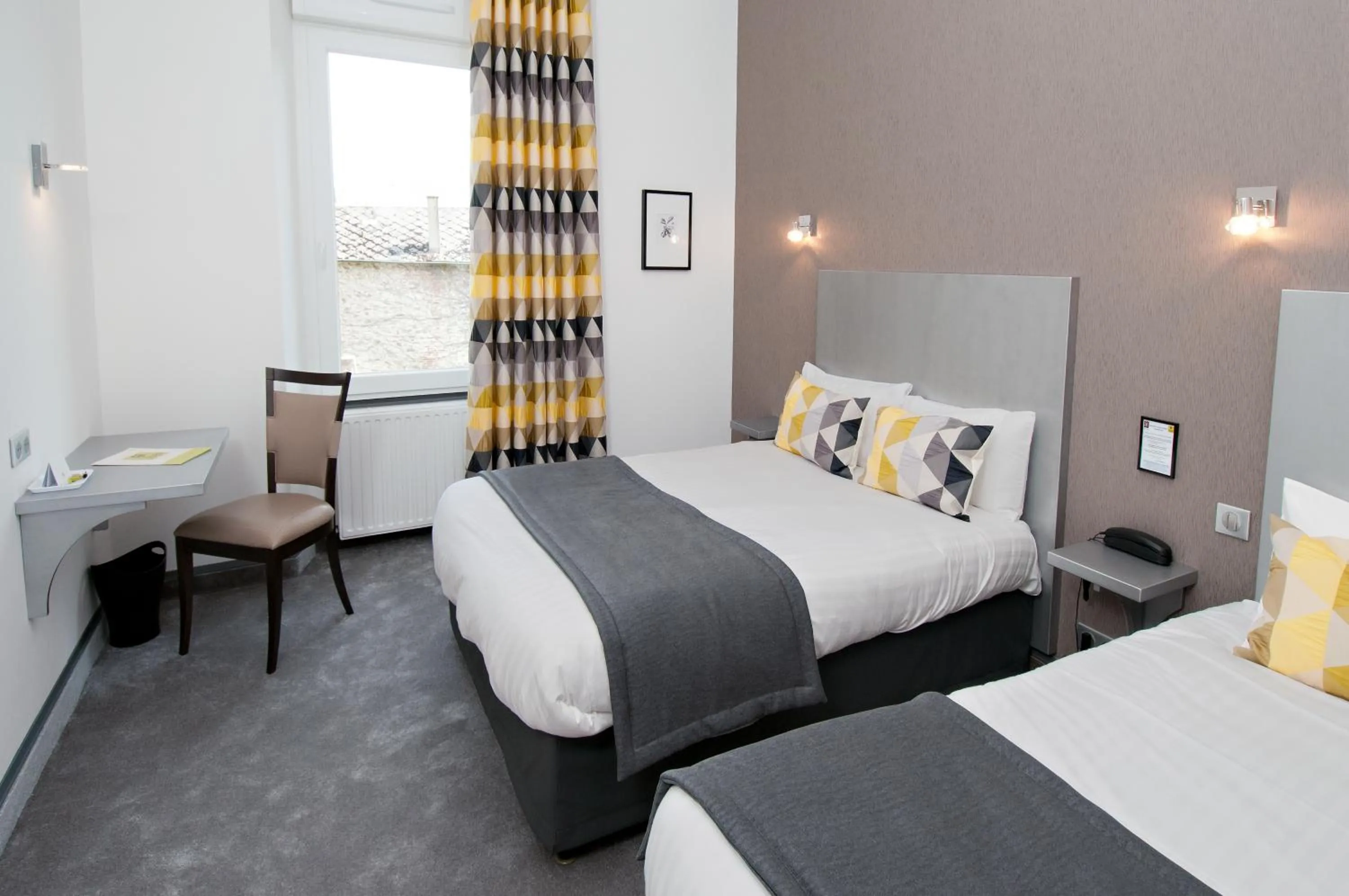 Bedroom in Logis Hotel Restaurant Nougier