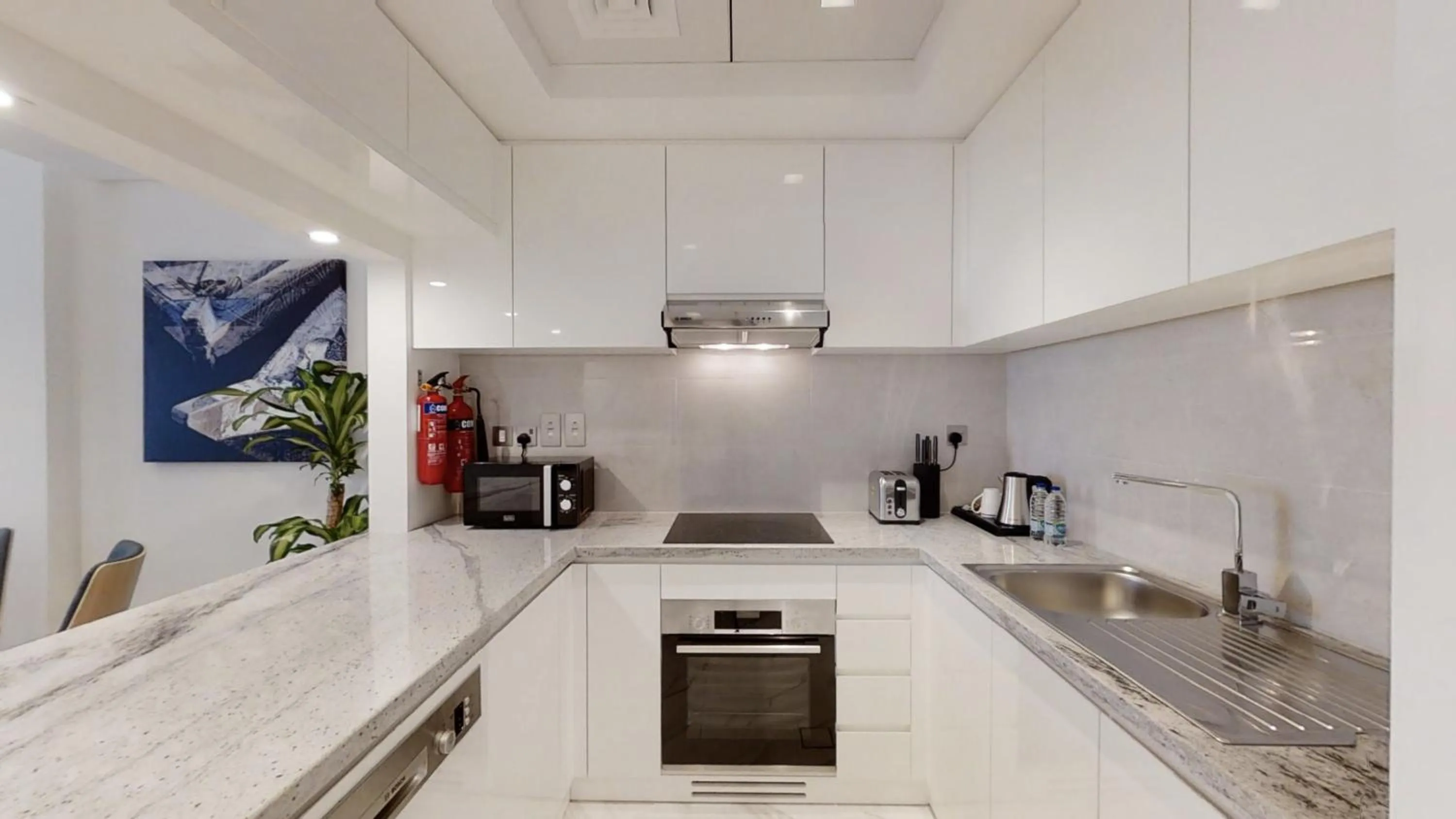 Kitchen or kitchenette in SUHA Mina Rashid Hotel Apartments