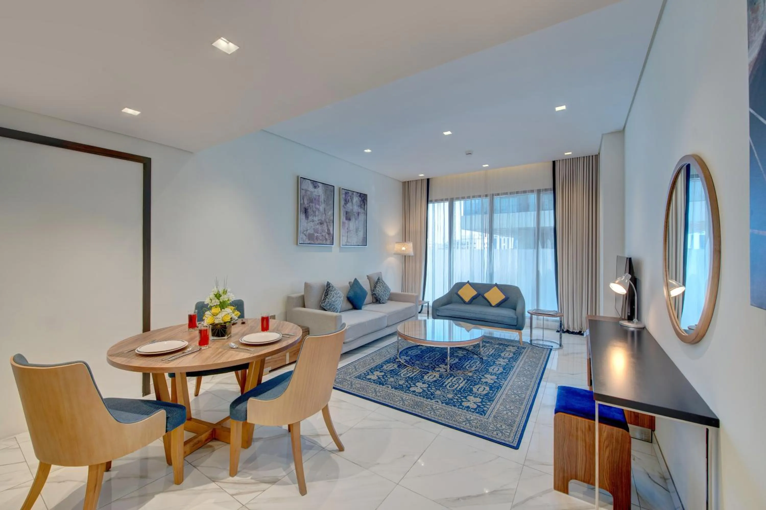 Living room, Bed in SUHA Mina Rashid Hotel Apartments