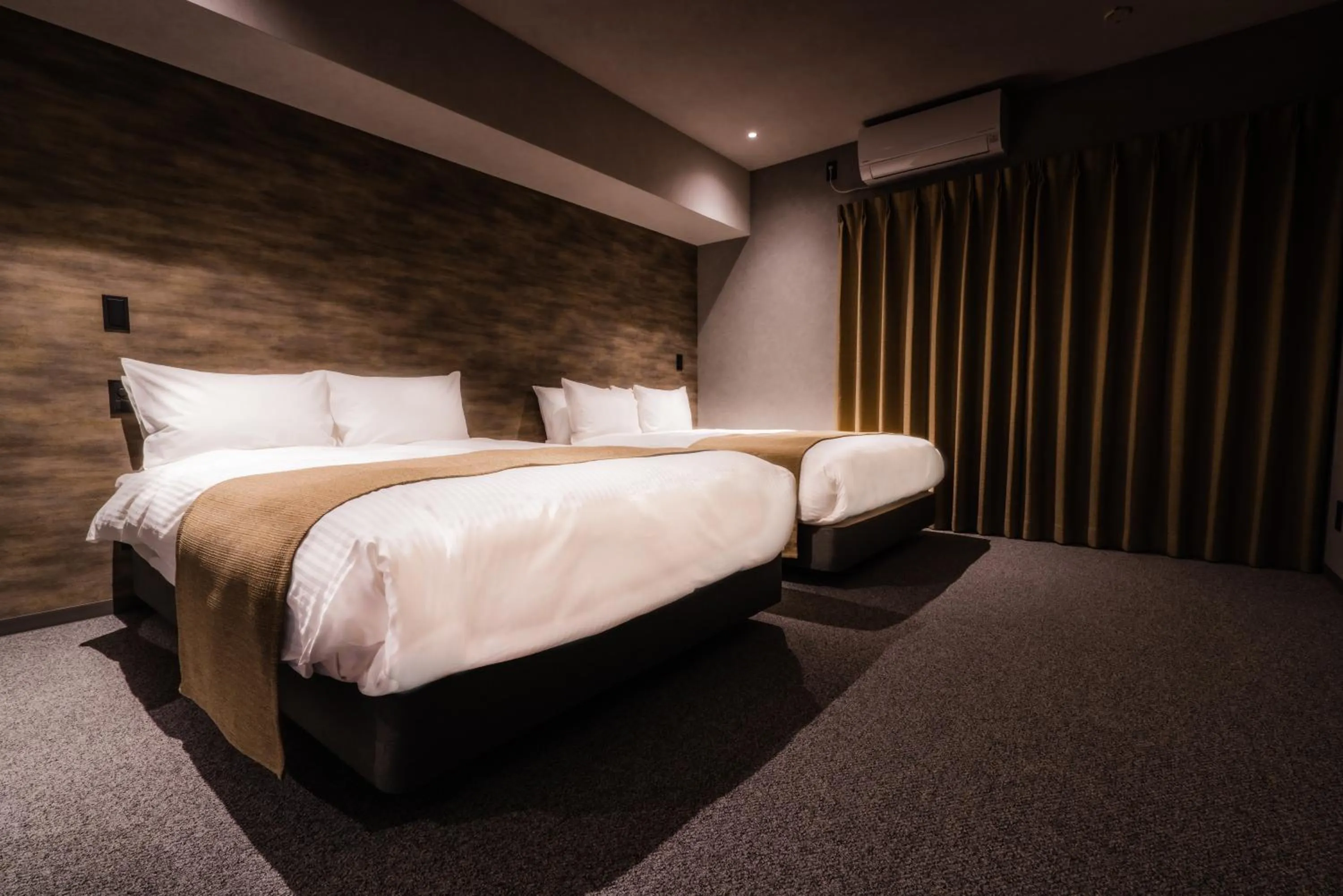 Bed in Randor Hotel Namba Osaka Suites