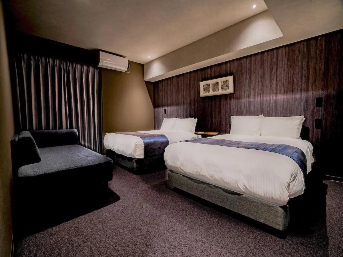 Bed in Randor Hotel Namba Osaka Suites