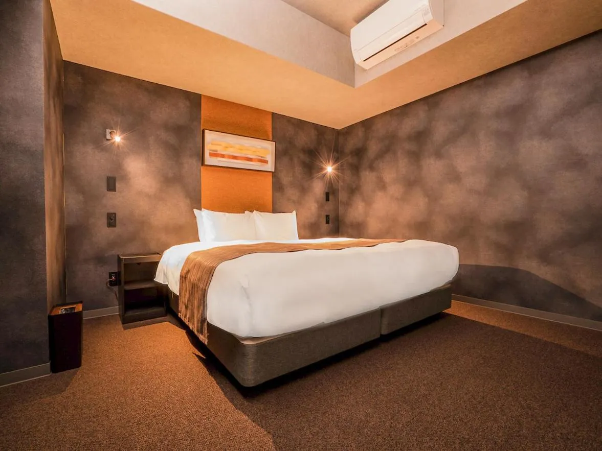 Bed in Randor Hotel Namba Osaka Suites