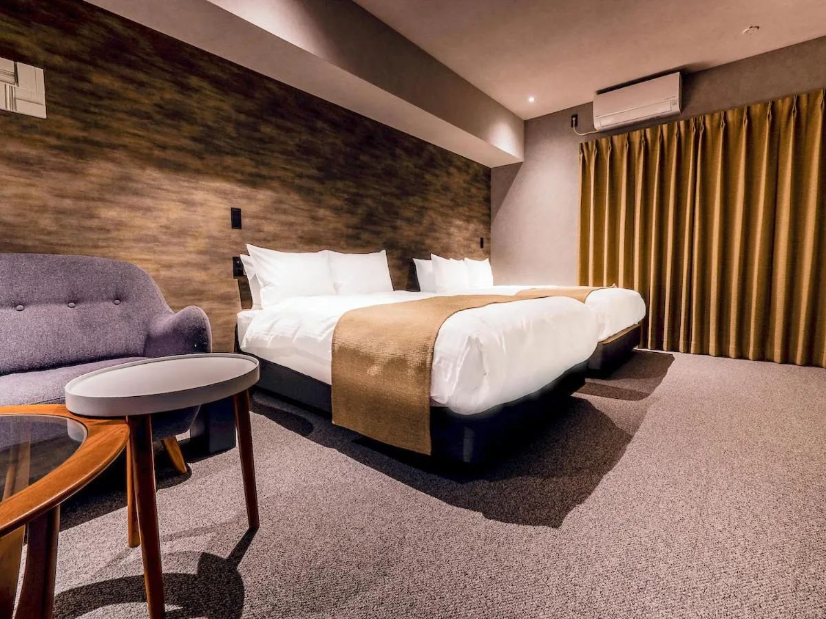 Bed in Randor Hotel Namba Osaka Suites