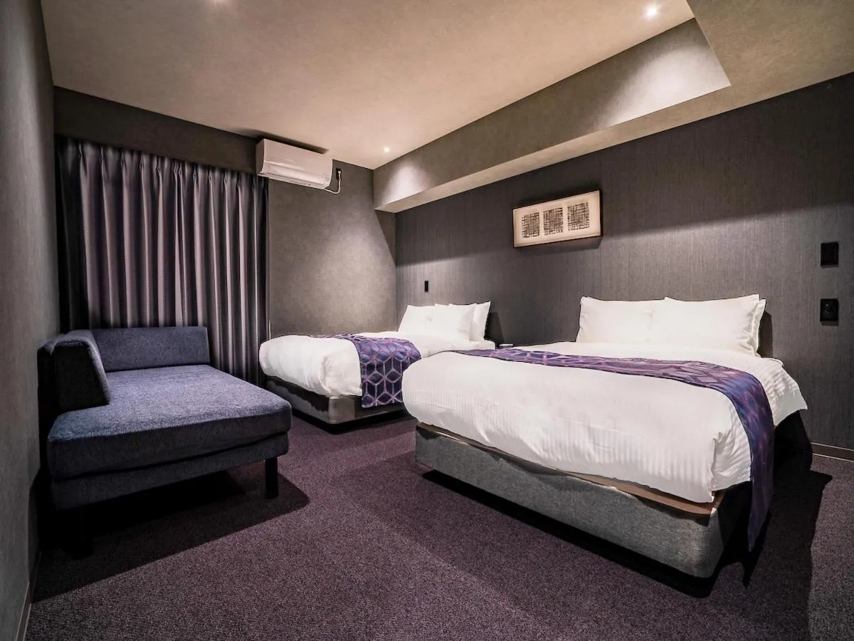 Bed in Randor Hotel Namba Osaka Suites