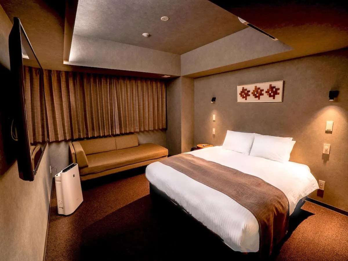 Bed in Randor Hotel Namba Osaka Suites