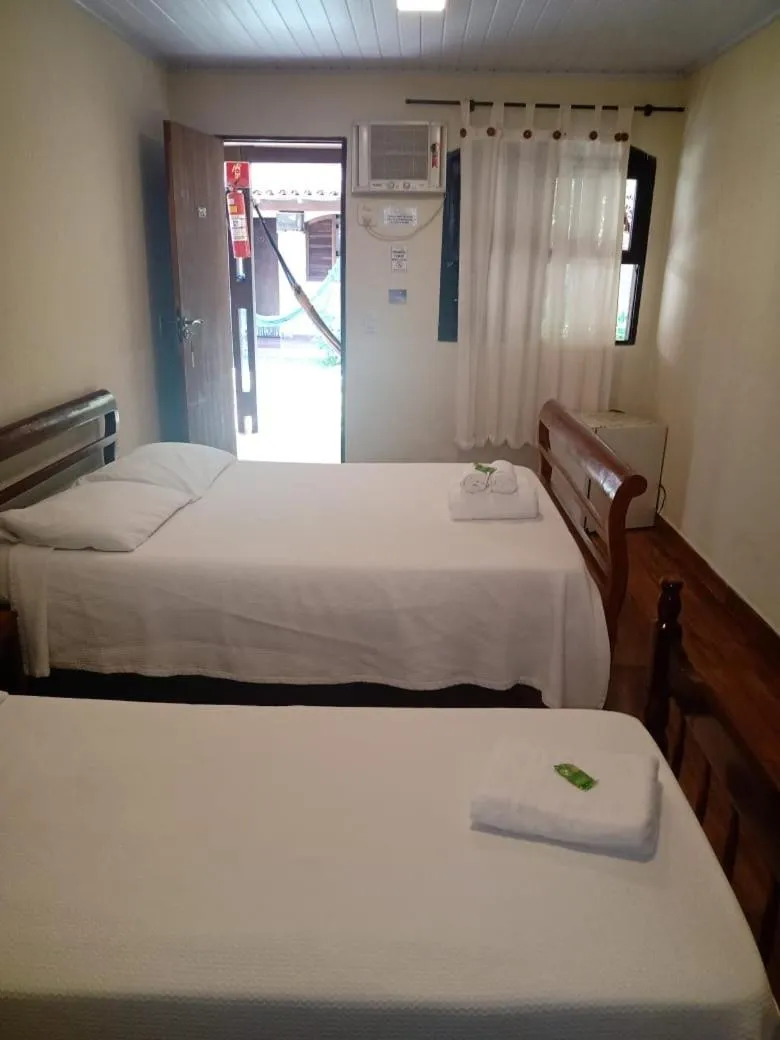 Bed in Pousada Thamalu
