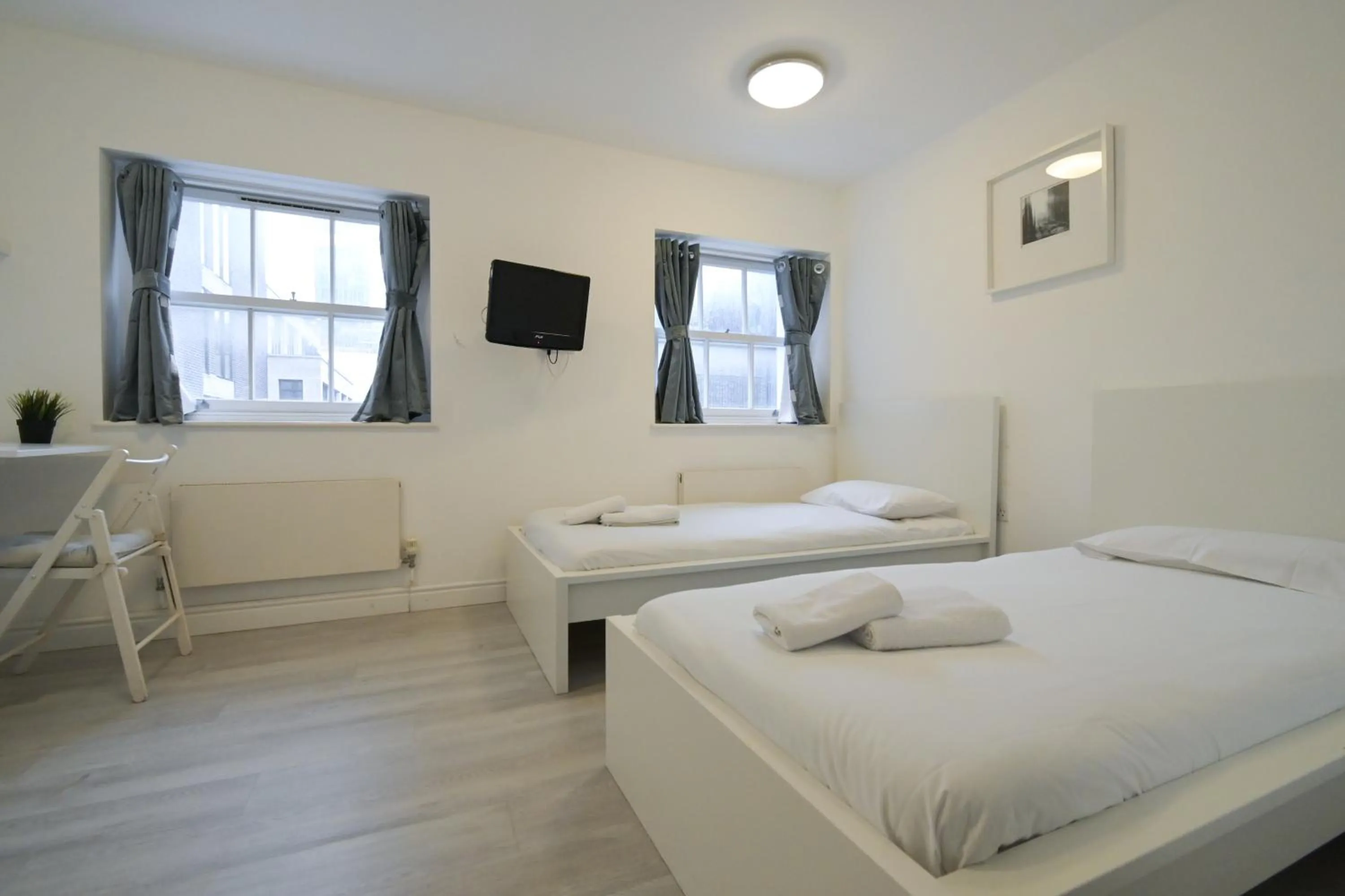 Bed in Charlotte Street Rooms by News Hotel