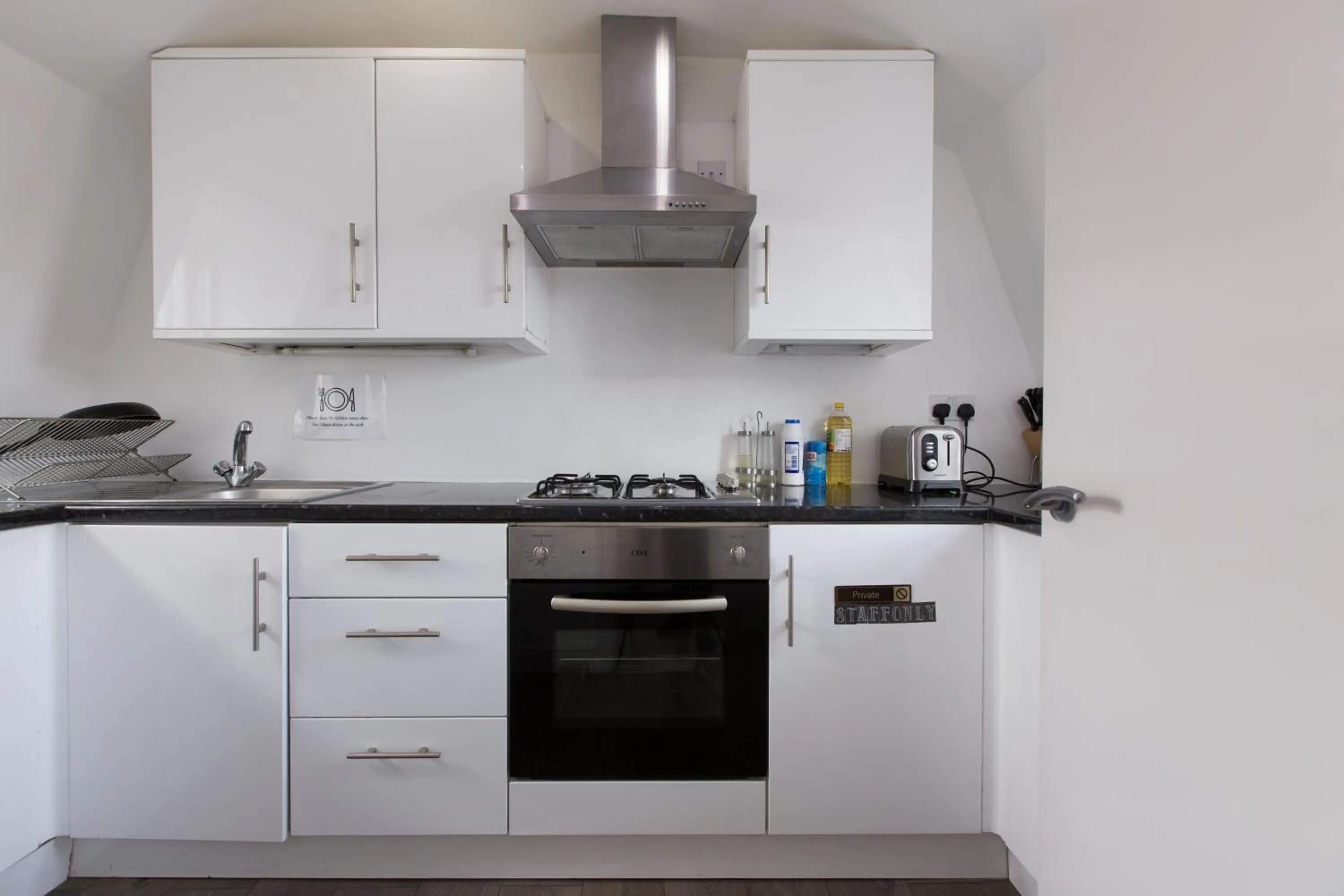 Communal kitchen in Charlotte Street Rooms by News Hotel