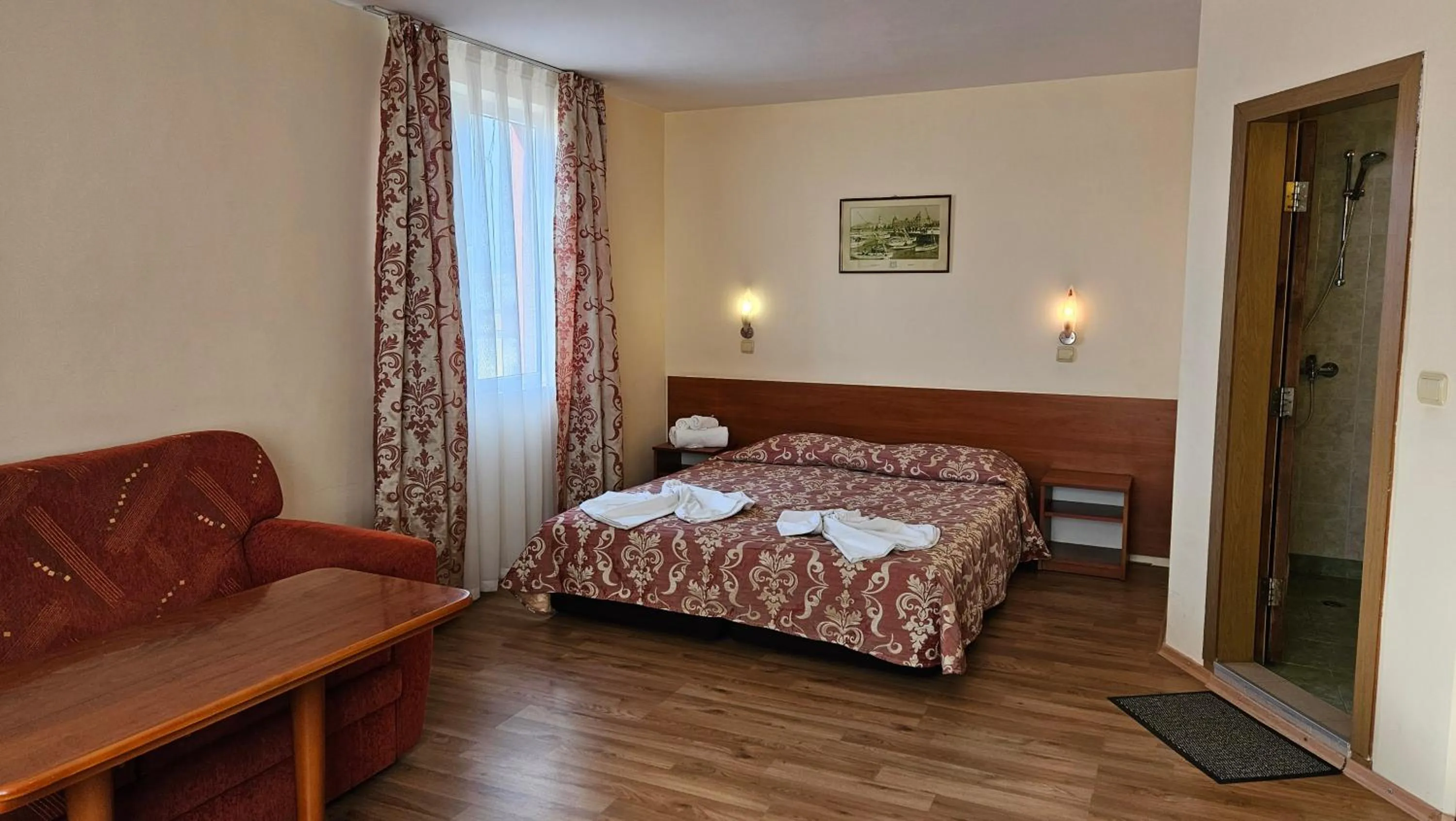 Bed in Caprice Family Hotel