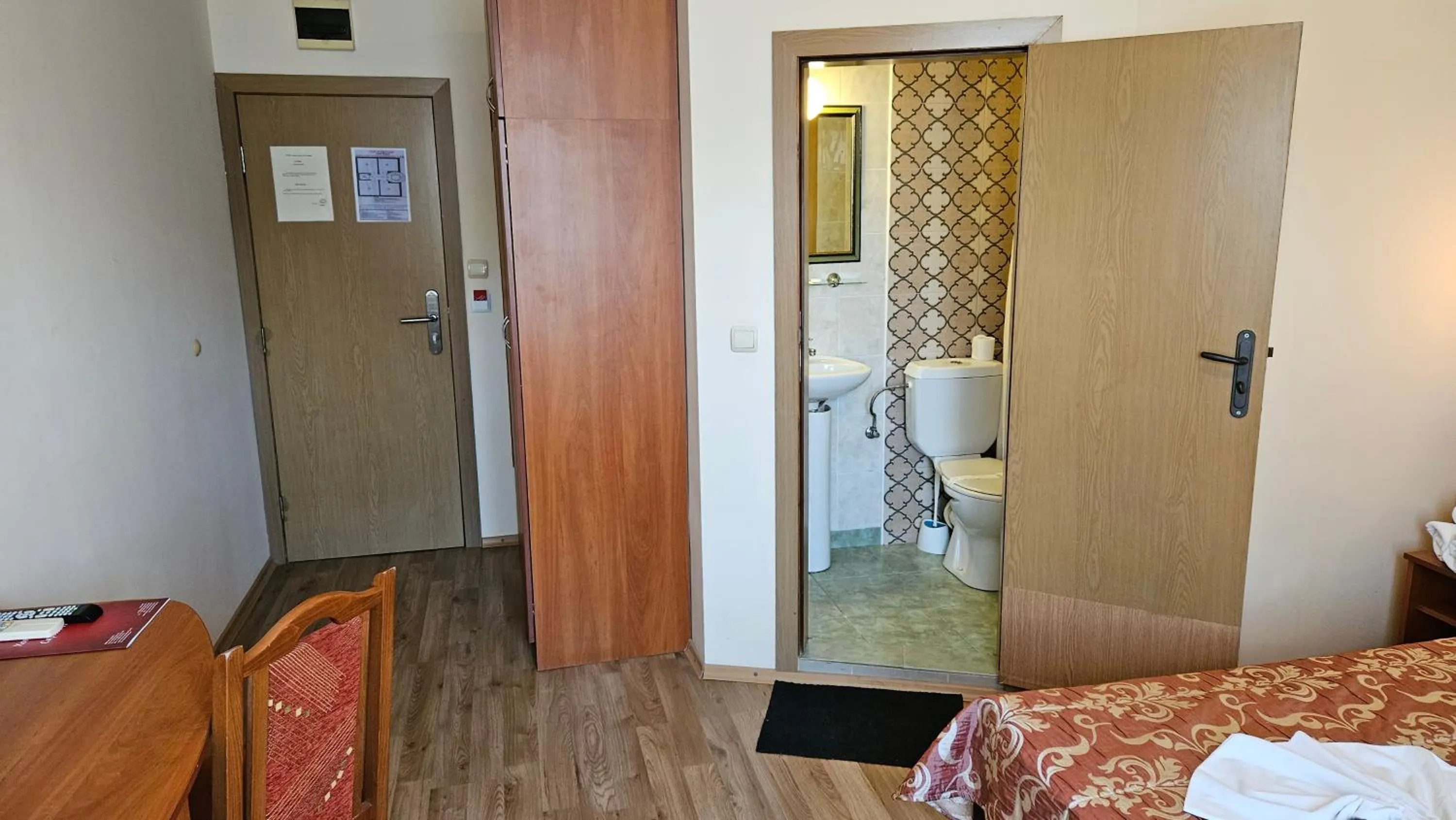 Bed in Caprice Family Hotel