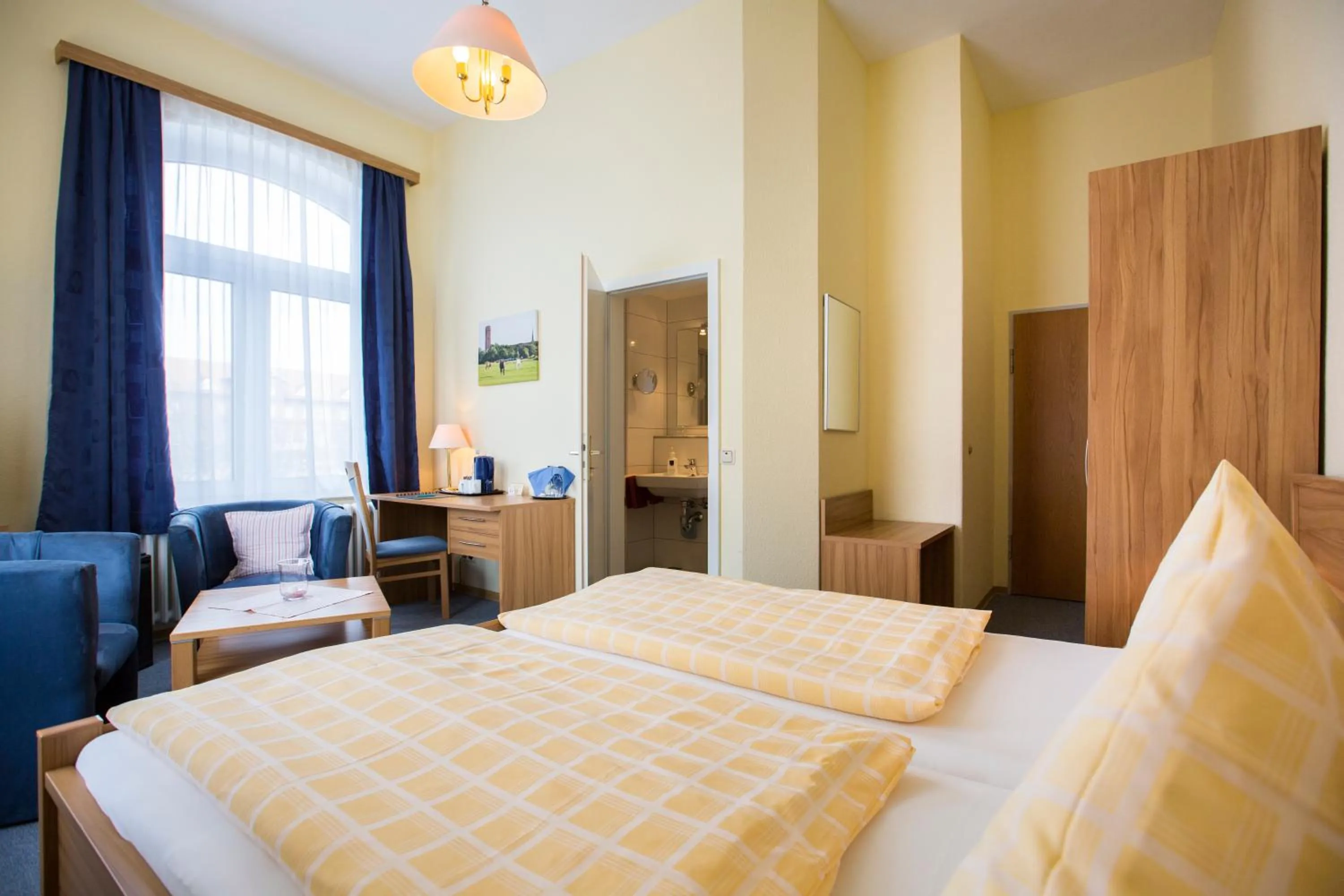 Seating area, Bed in Hotel Graf Waldersee