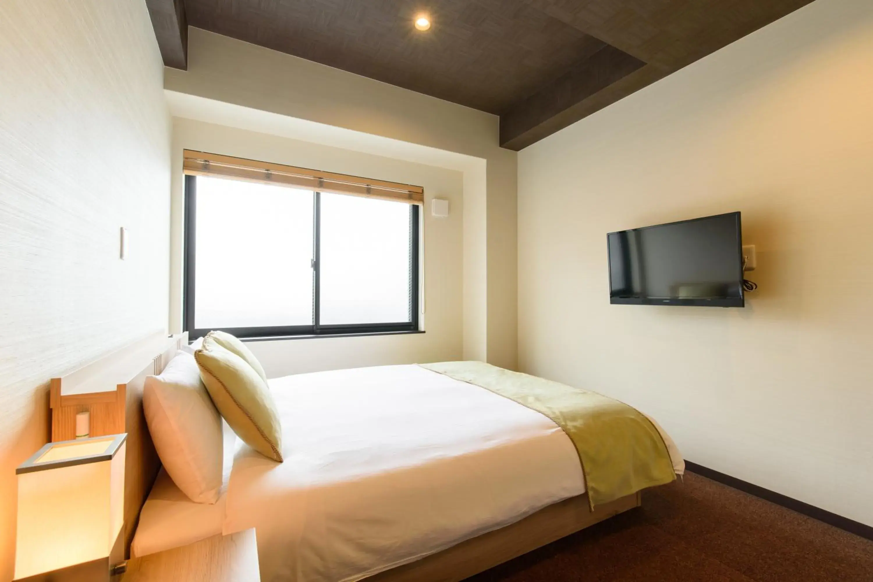 Bed in JP INN Kyoto Ekimae Mongakucho Bed in JP INN Kyoto Ekimae Mongakucho