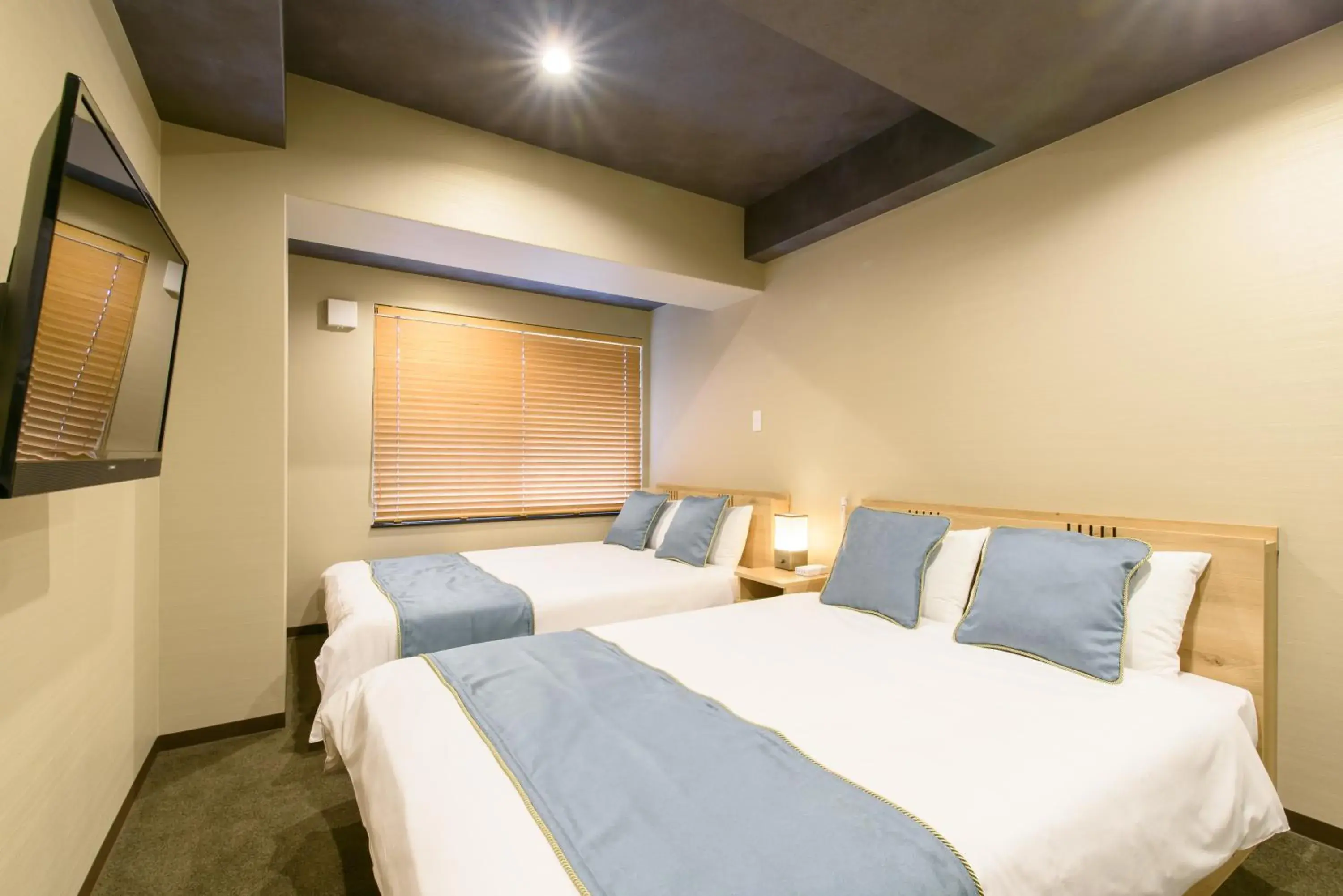 Bed in JP INN Kyoto Ekimae Mongakucho Bed in JP INN Kyoto Ekimae Mongakucho