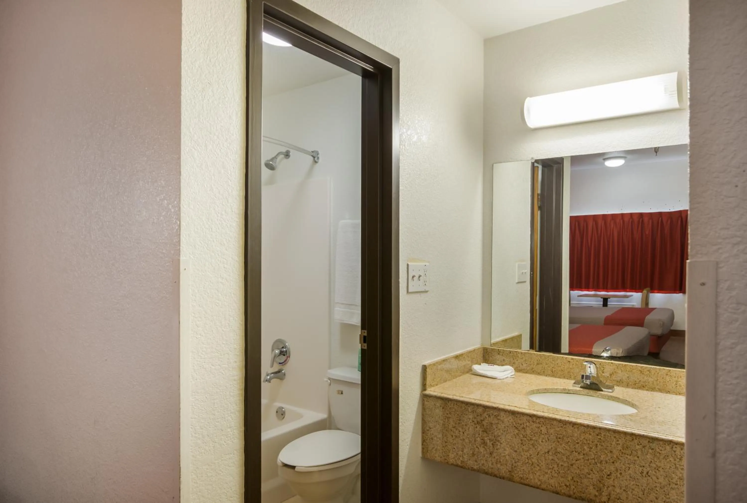 Bathroom, Bed in Americas Best Value Inn & Suites Humble