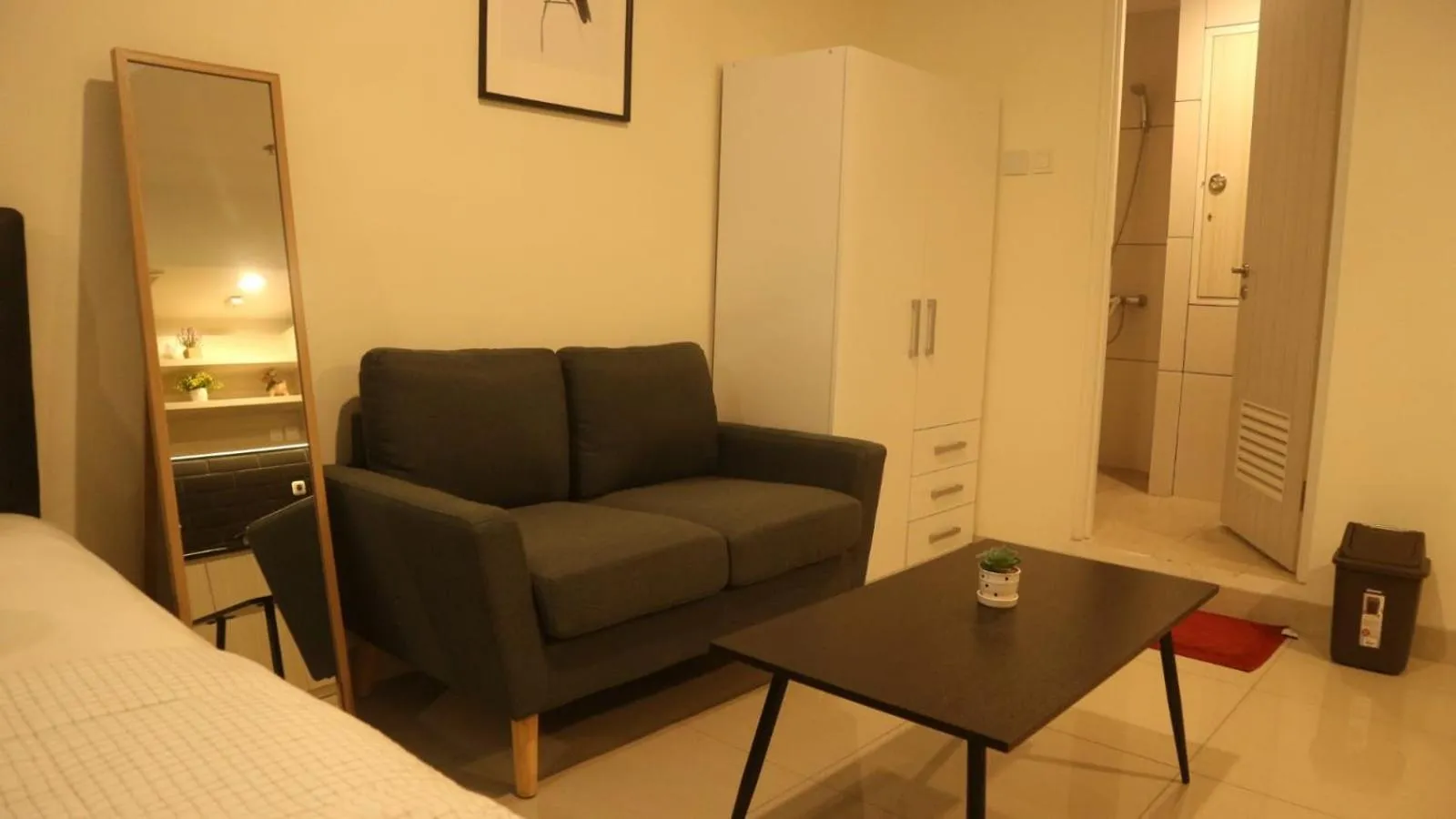 Seating area in Apartemen Grand Kamala Lagoon by Cheapinn