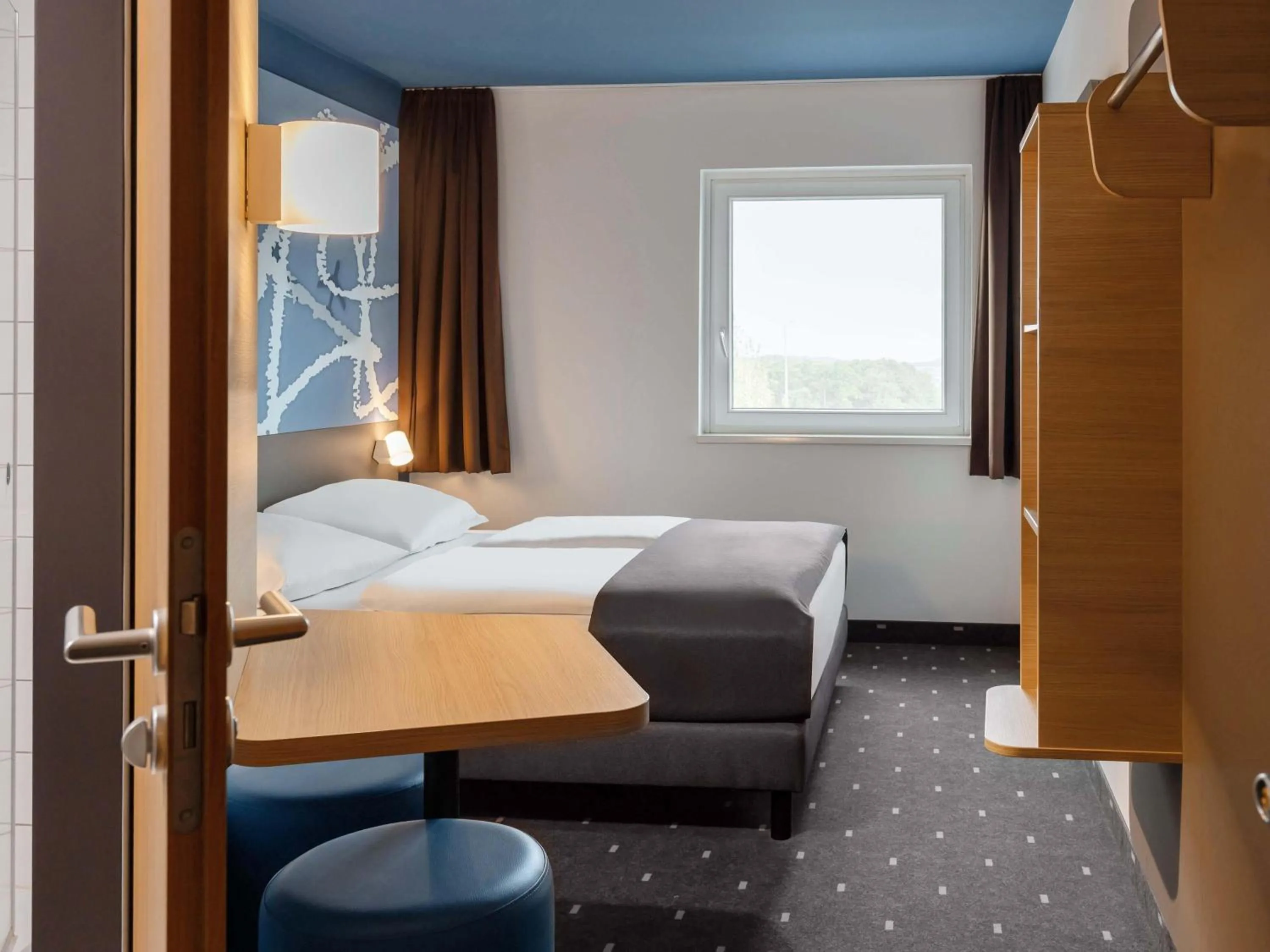 Photo of the whole room, Bed in B&B HOTEL Frankfurt-Hahn Airport