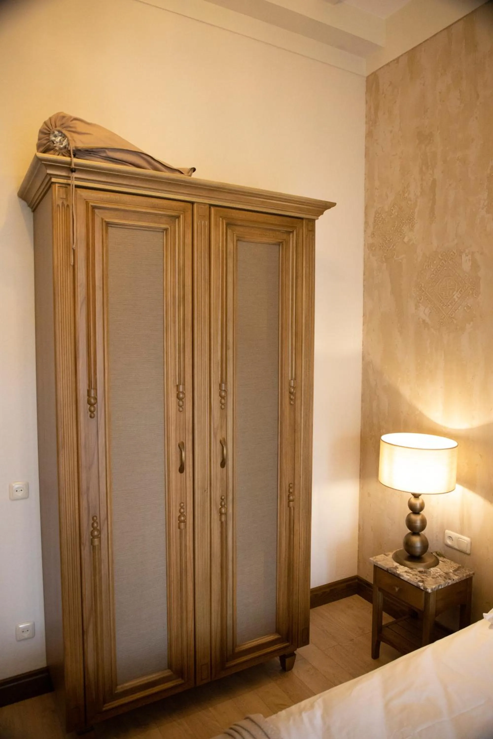 wardrobe, Bed in Boutique ETHNO HOTEL