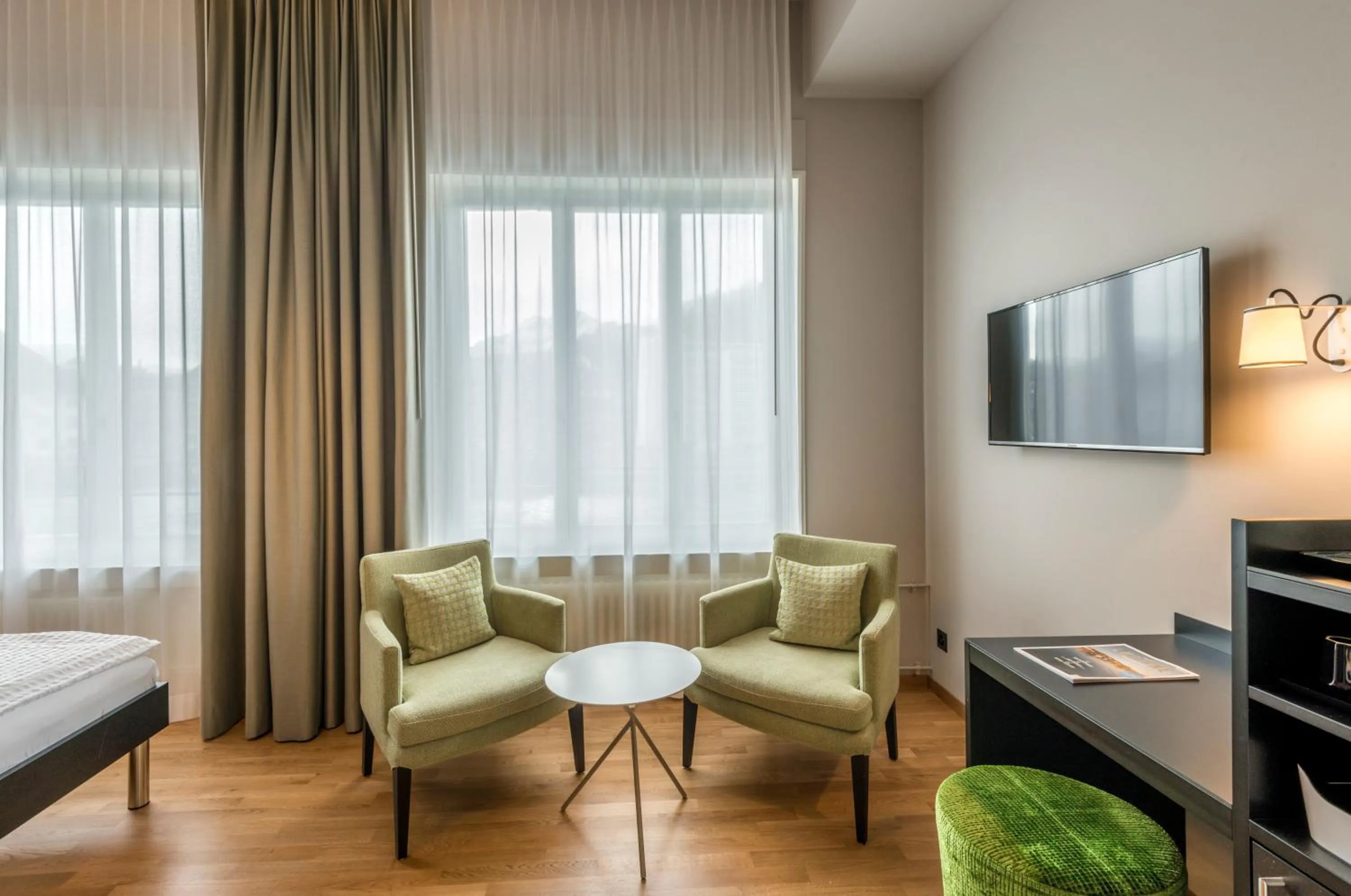 Communal lounge/ TV room, Bed in Boutique Hotel KARL