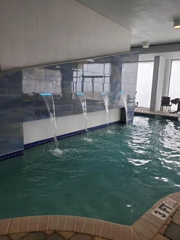 Pool view in Luxury 2 bedroom 2 bathroom Ocean Front Condo on the 12th floor for 8