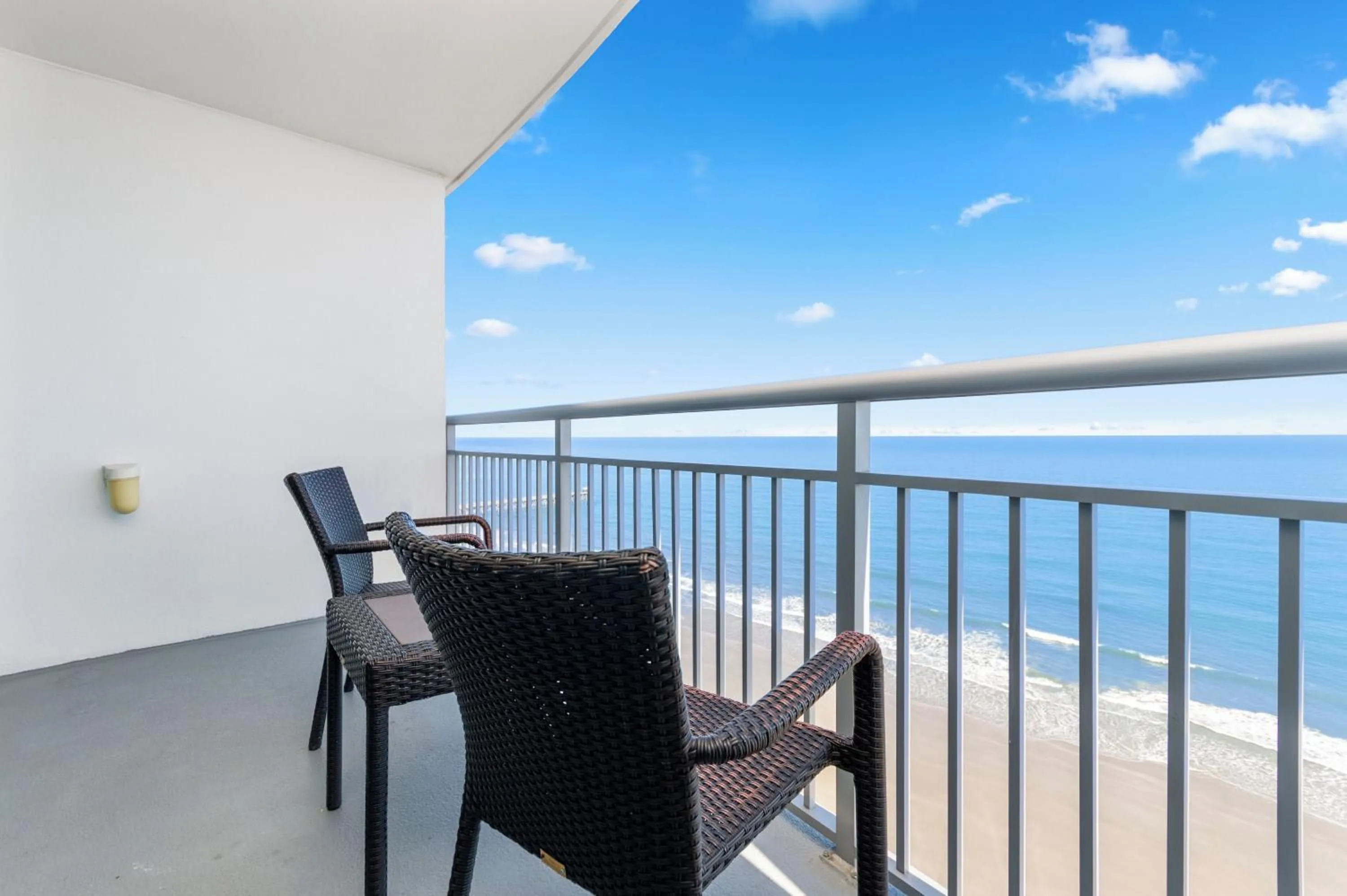 Patio in Luxury 2 bedroom 2 bathroom Ocean Front Condo on the 12th floor for 8