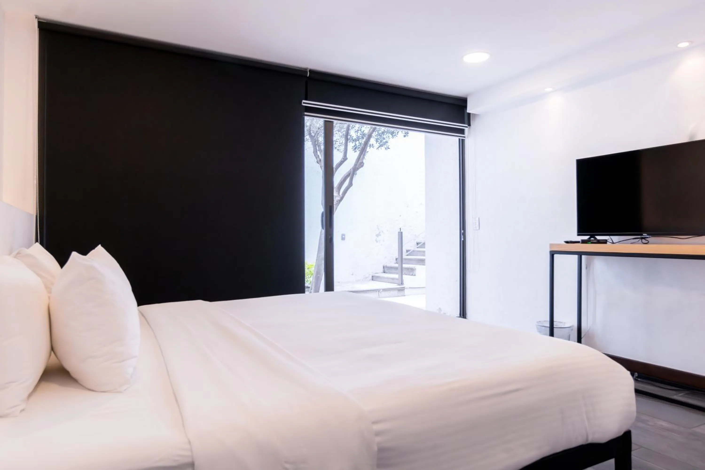 Bed in Urban Puebla by Grupo Amber