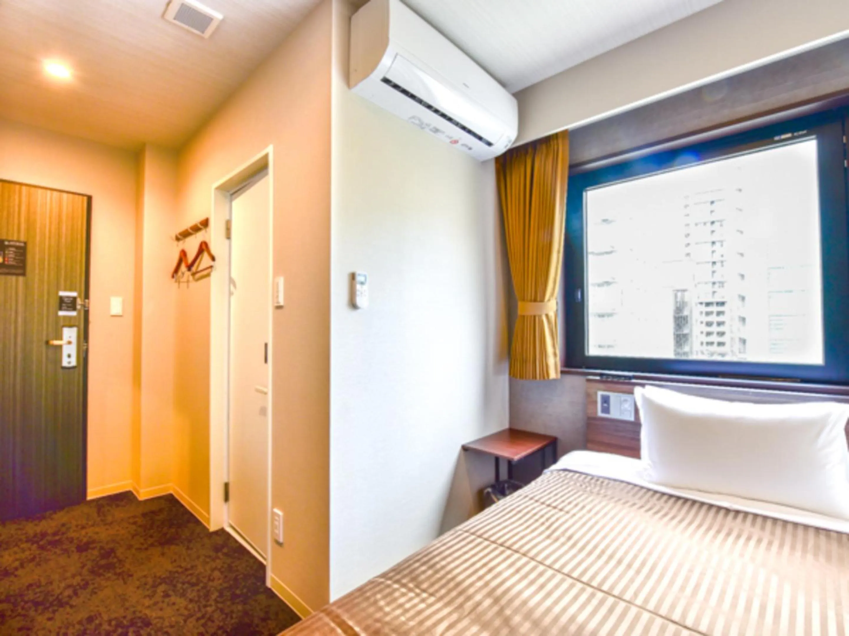 Bed in HOTEL LiVEMAX Fukuoka Tenjin West