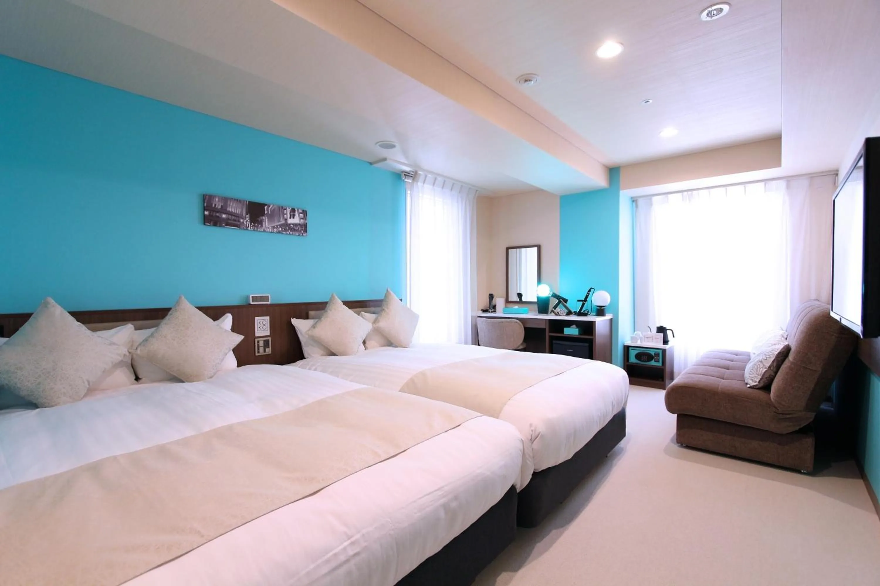 Bed in KOKO HOTEL Ginza-1chome