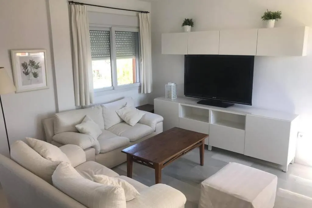 Communal lounge/ TV room in Precioso apartamento muy cerca de la playa