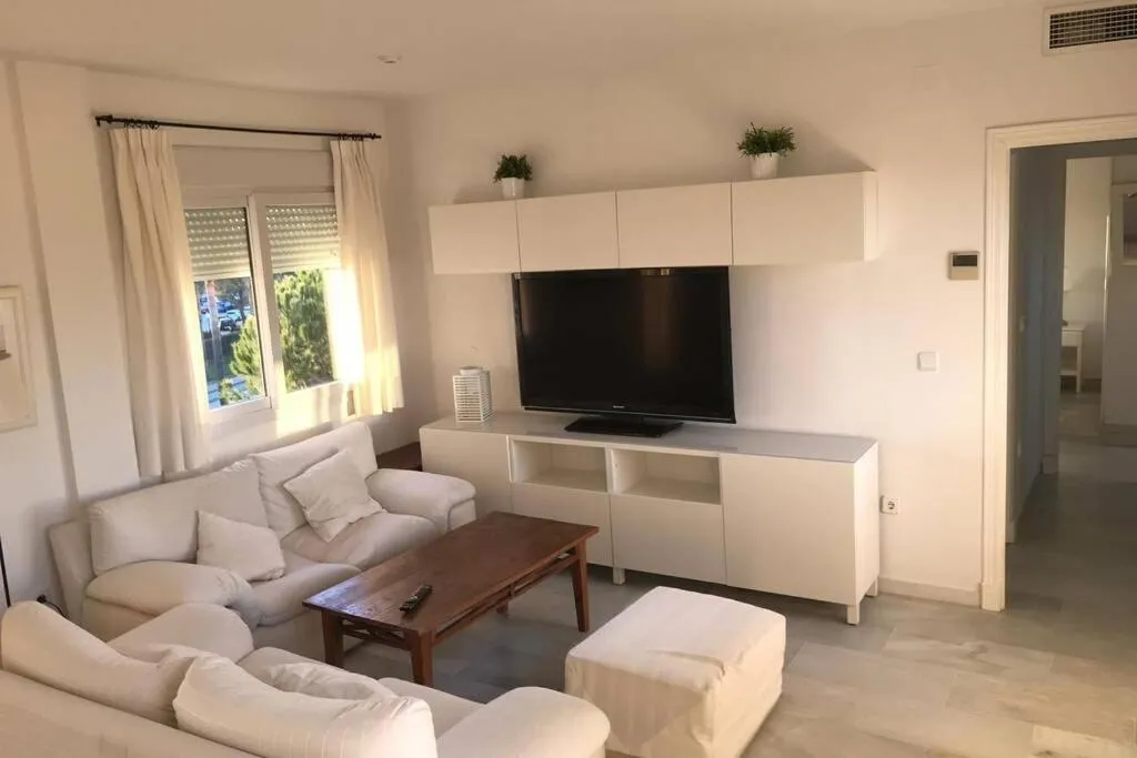 Communal lounge/ TV room in Precioso apartamento muy cerca de la playa