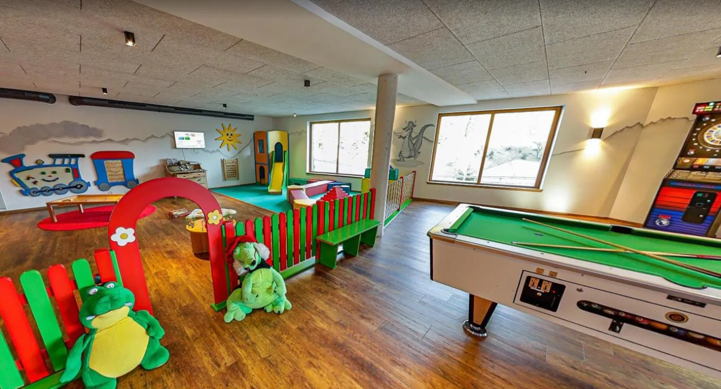 Communal lounge/ TV room in Feuriger Tatzlwurm Berghotel & Spa, BW Signature Collection