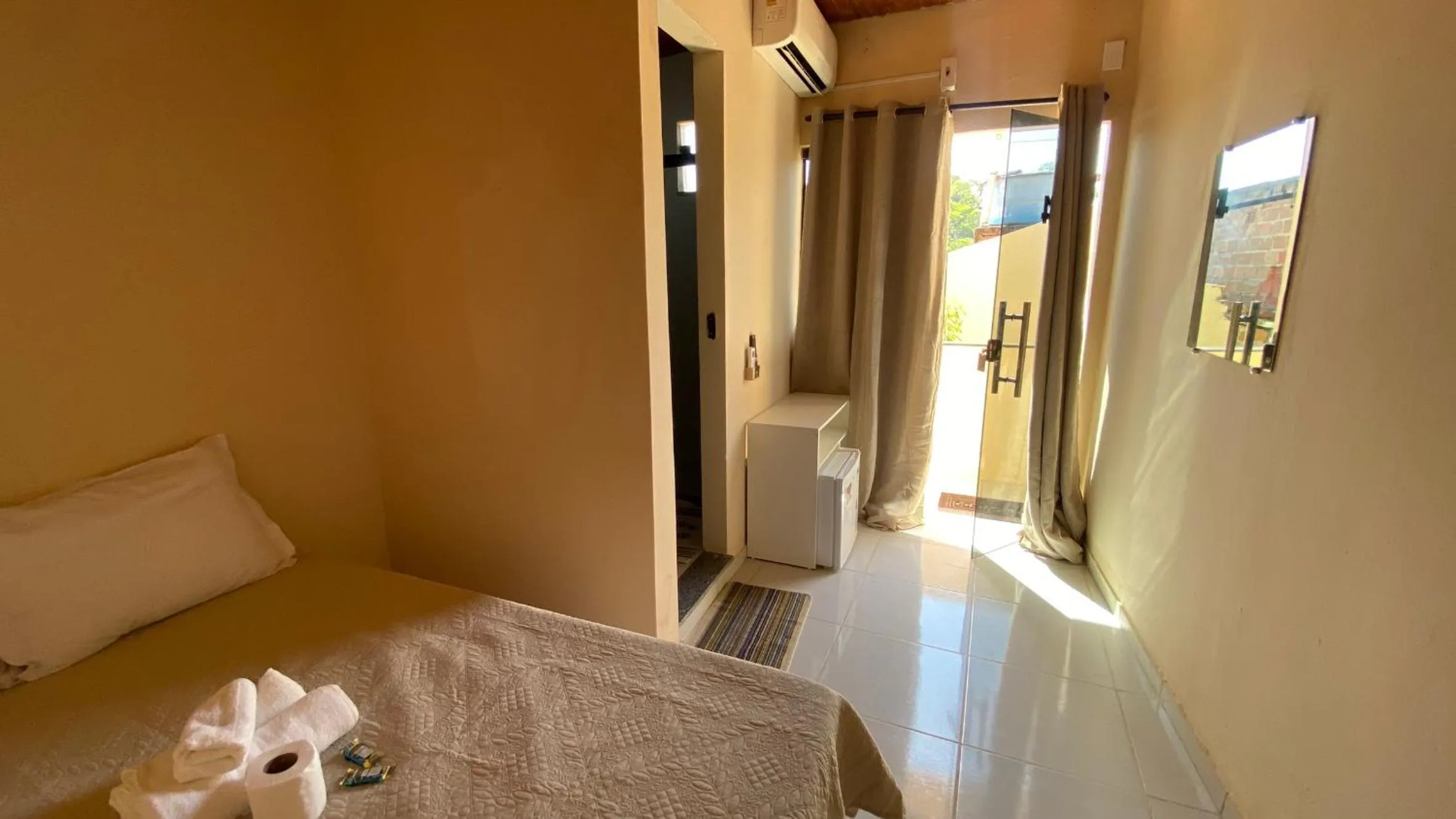 Property building, Bed in Pousada Floripes