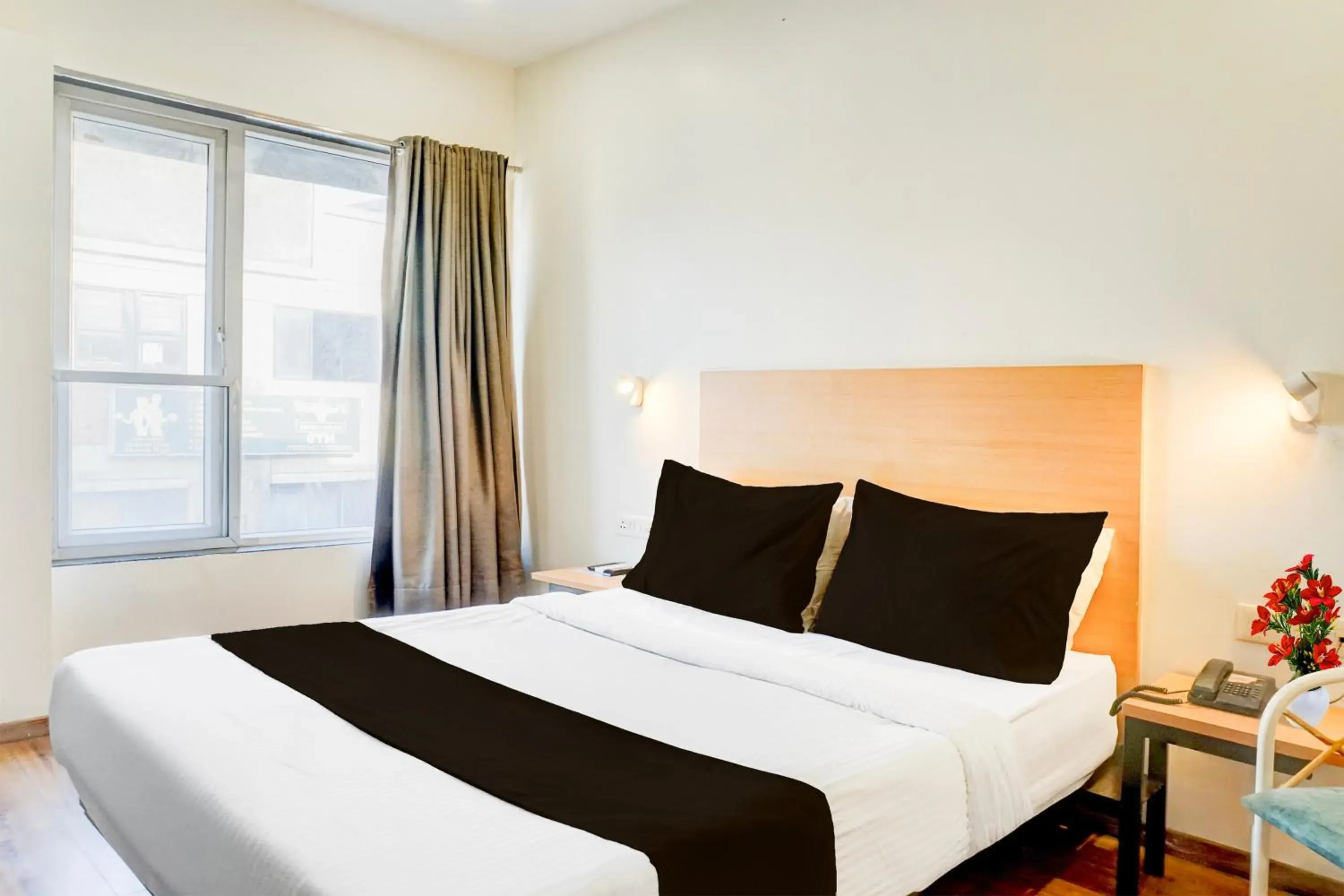 Bedroom, Bed in Super Townhouse MG Road Pune Bedroom, Bed in Super Townhouse MG Road Pune