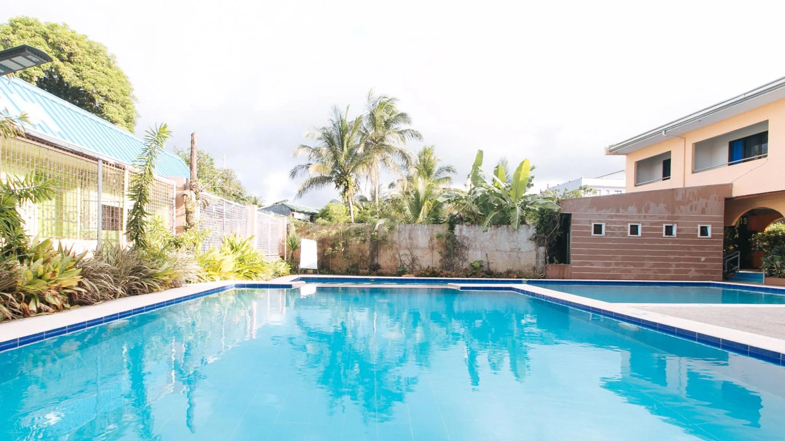 Pool view in RedDoorz Plus near Municipality of Luisiana Laguna