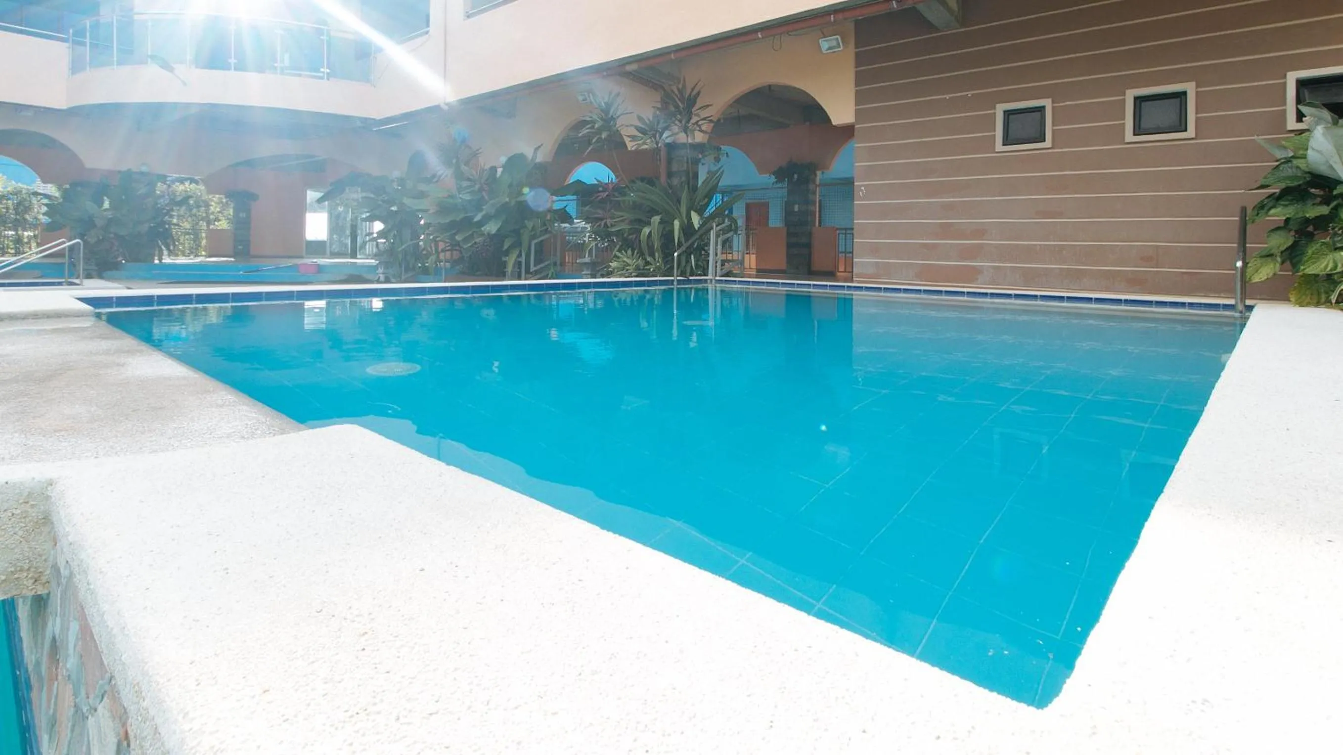 Swimming pool in RedDoorz Plus near Municipality of Luisiana Laguna
