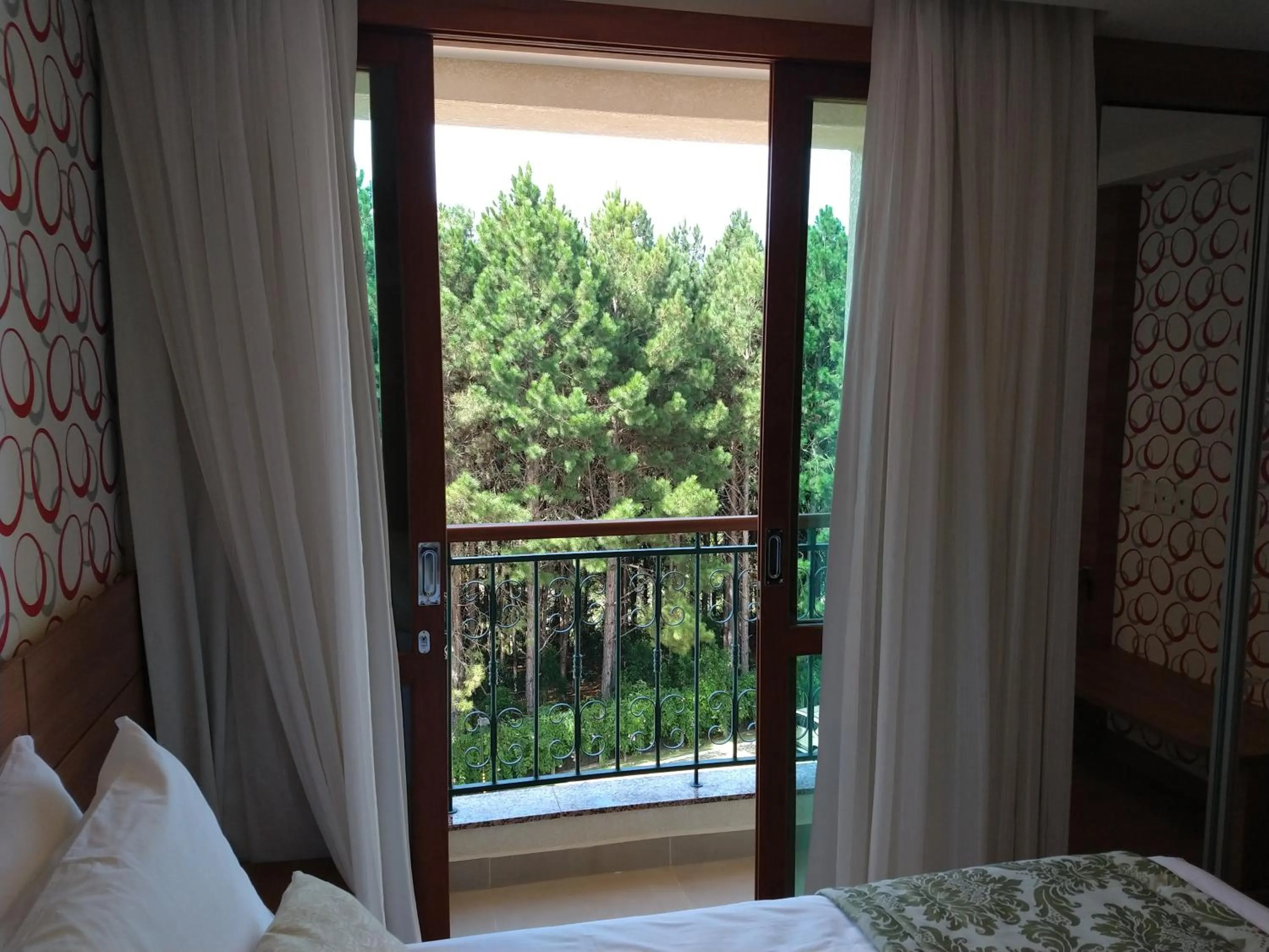 Living room, Bed in Suíte Charmosa em Pedra Azul
