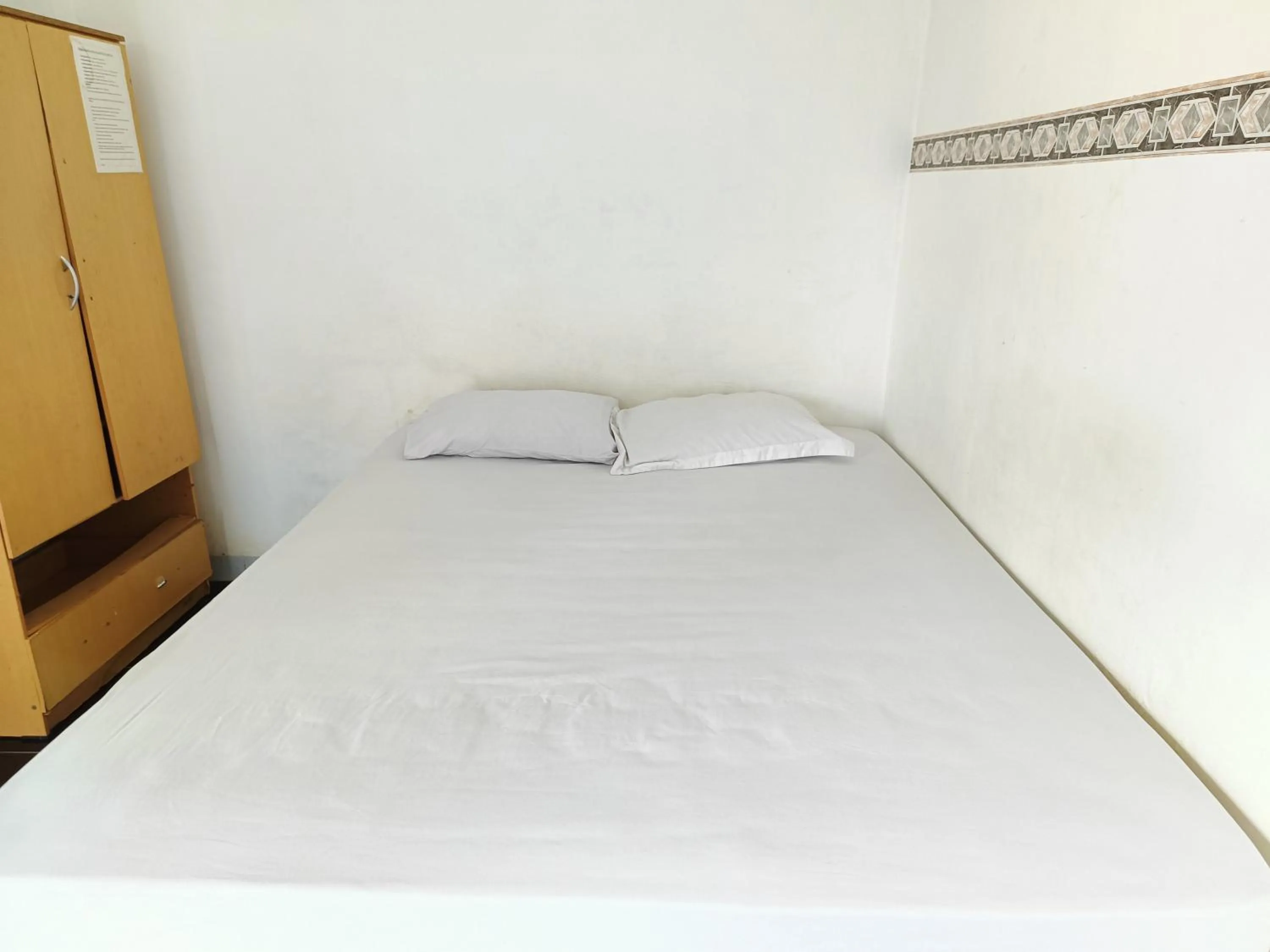 Bed in Bumi Merpati Residence Makassar Mitra RedDoorz