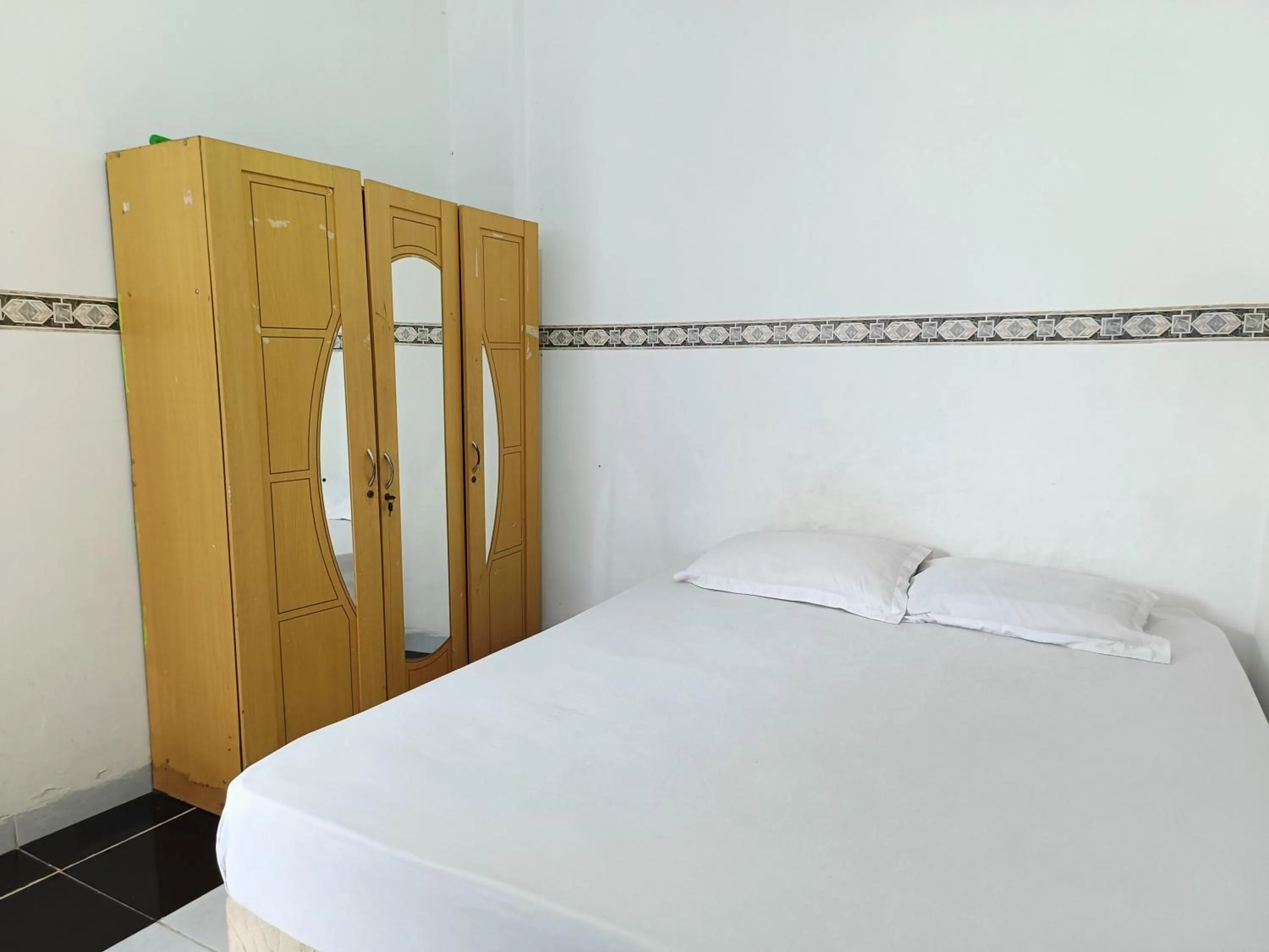 Bed in Bumi Merpati Residence Makassar Mitra RedDoorz