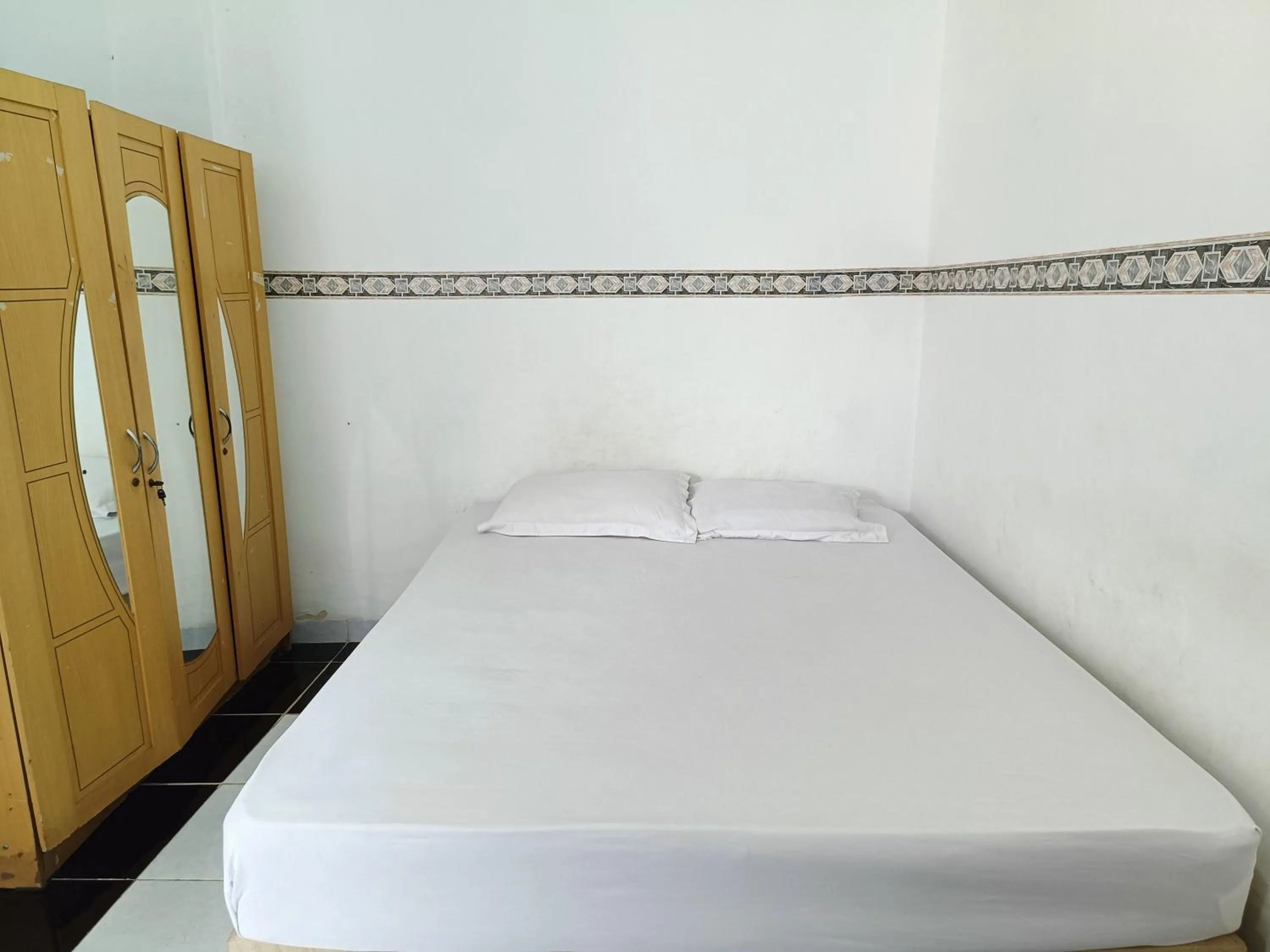 Bed in Bumi Merpati Residence Makassar Mitra RedDoorz