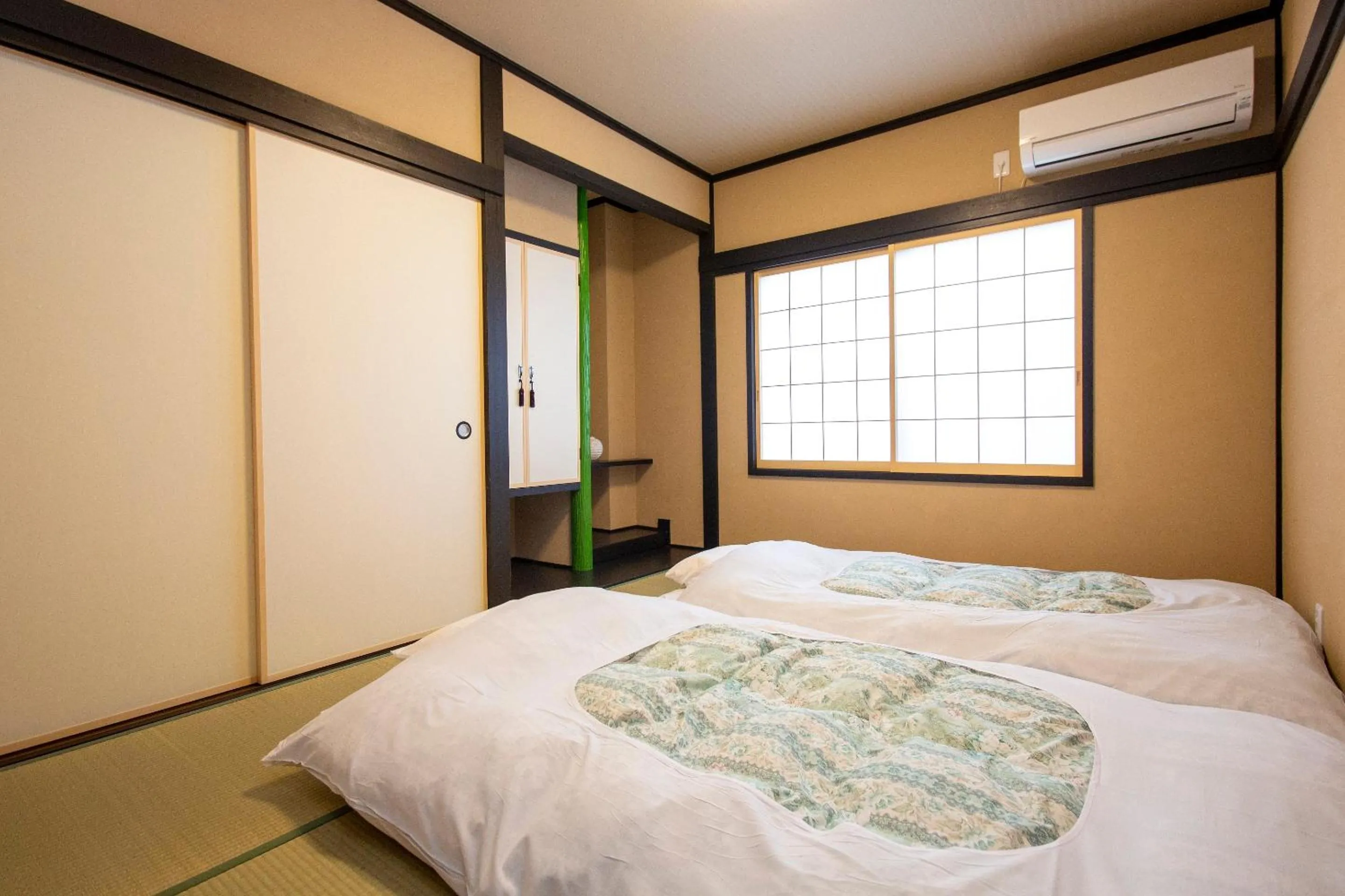 Photo of the whole room, Bed in The RYOKAN O